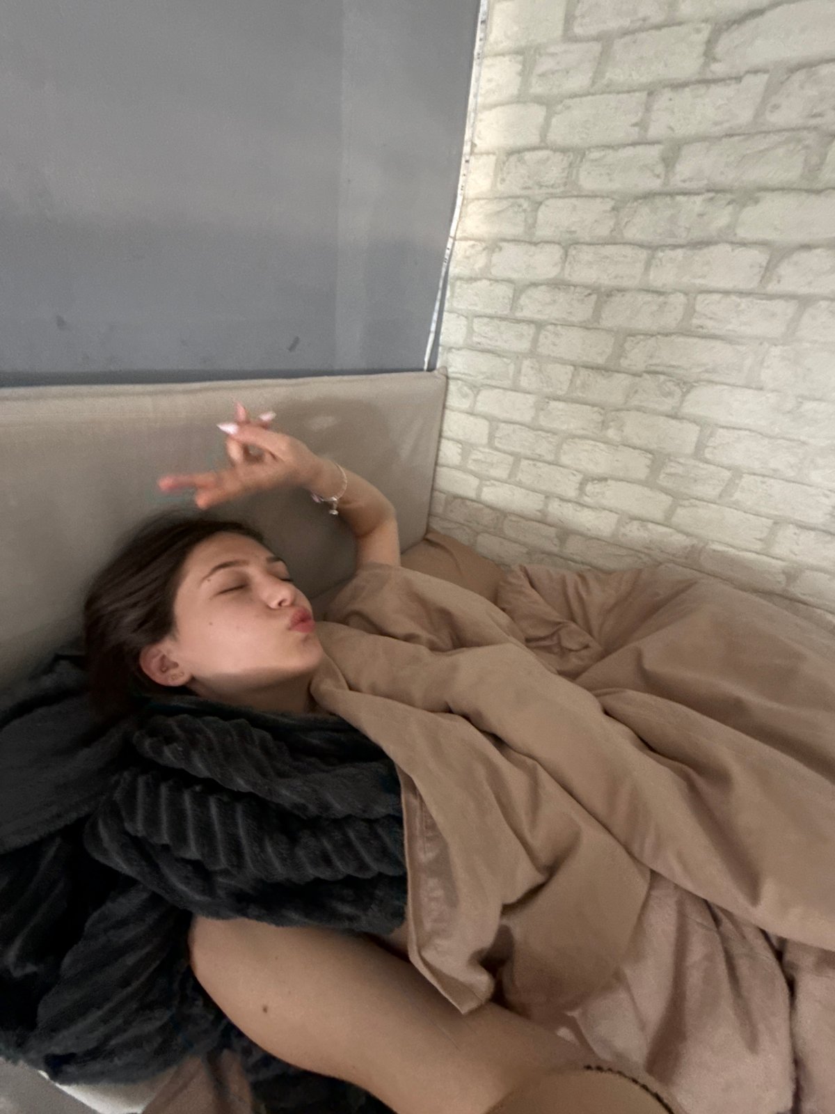 Woman photographed resting in bed in Sofia morning