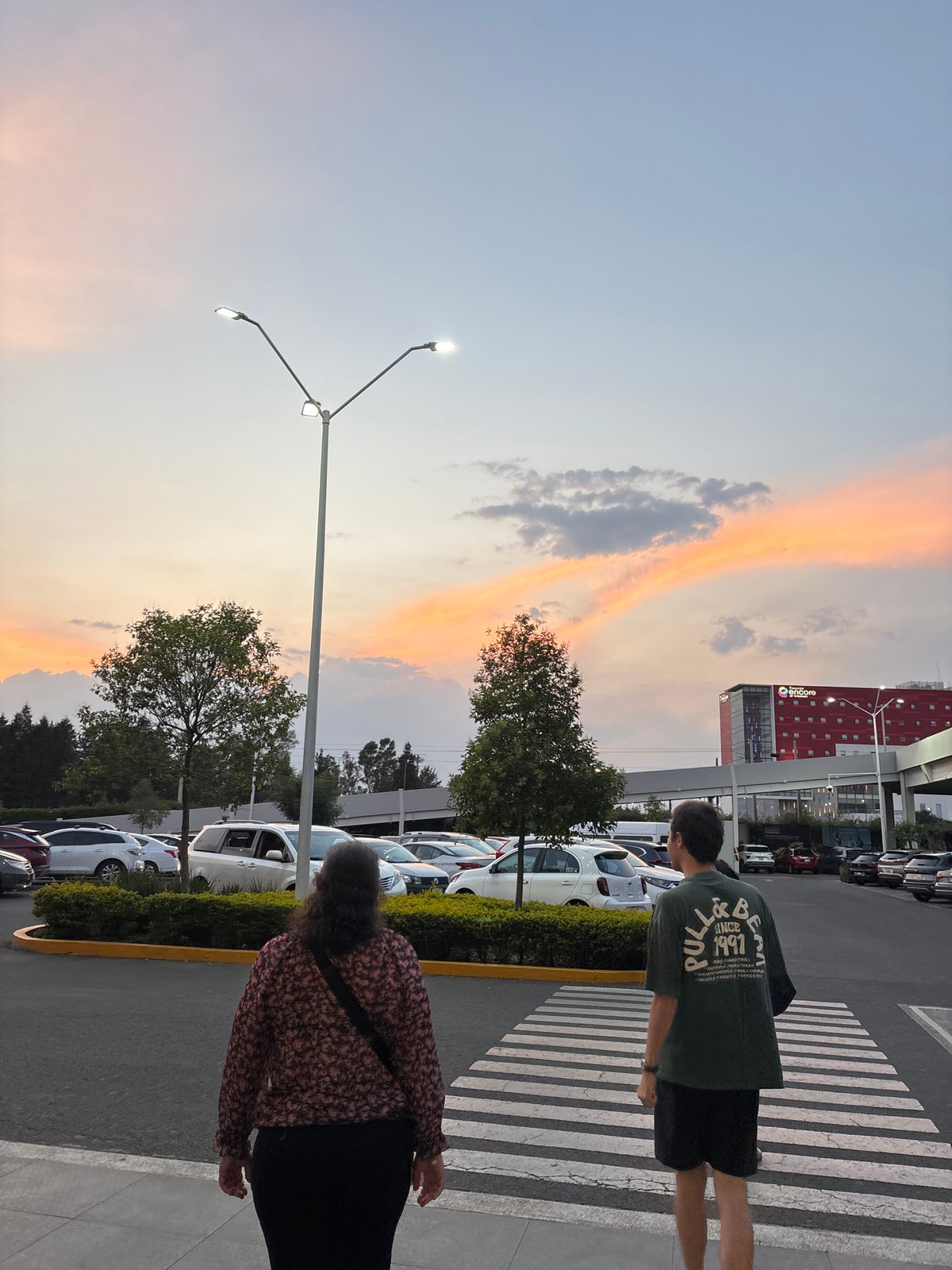 Dawn scenes documented at Mexico shopping center with eagle sculpture