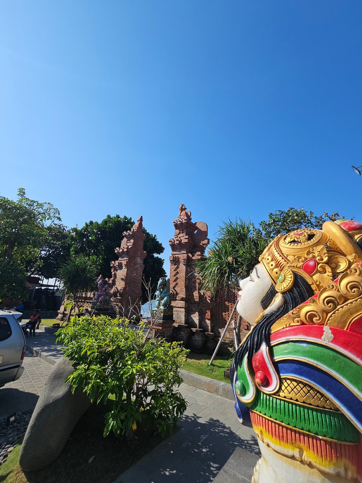 Denpasar's coastline and monuments on a busy July morning
