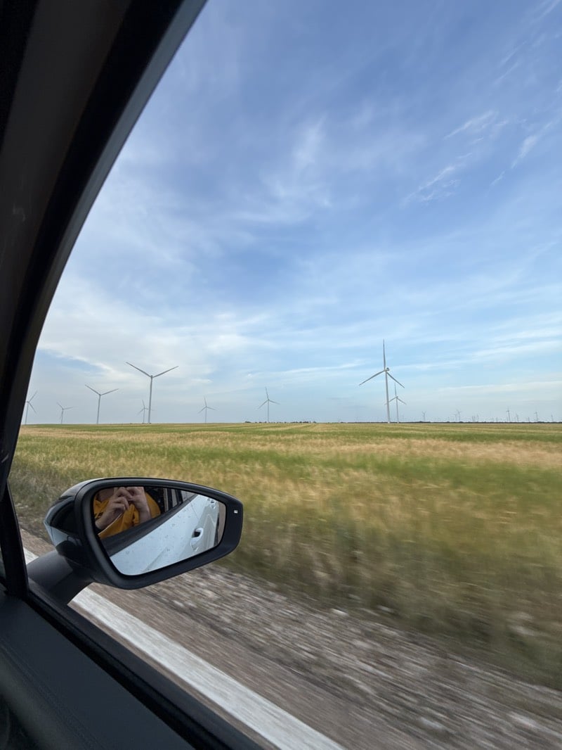 Rural Spain wheat fields documented with wind turbines backdrop