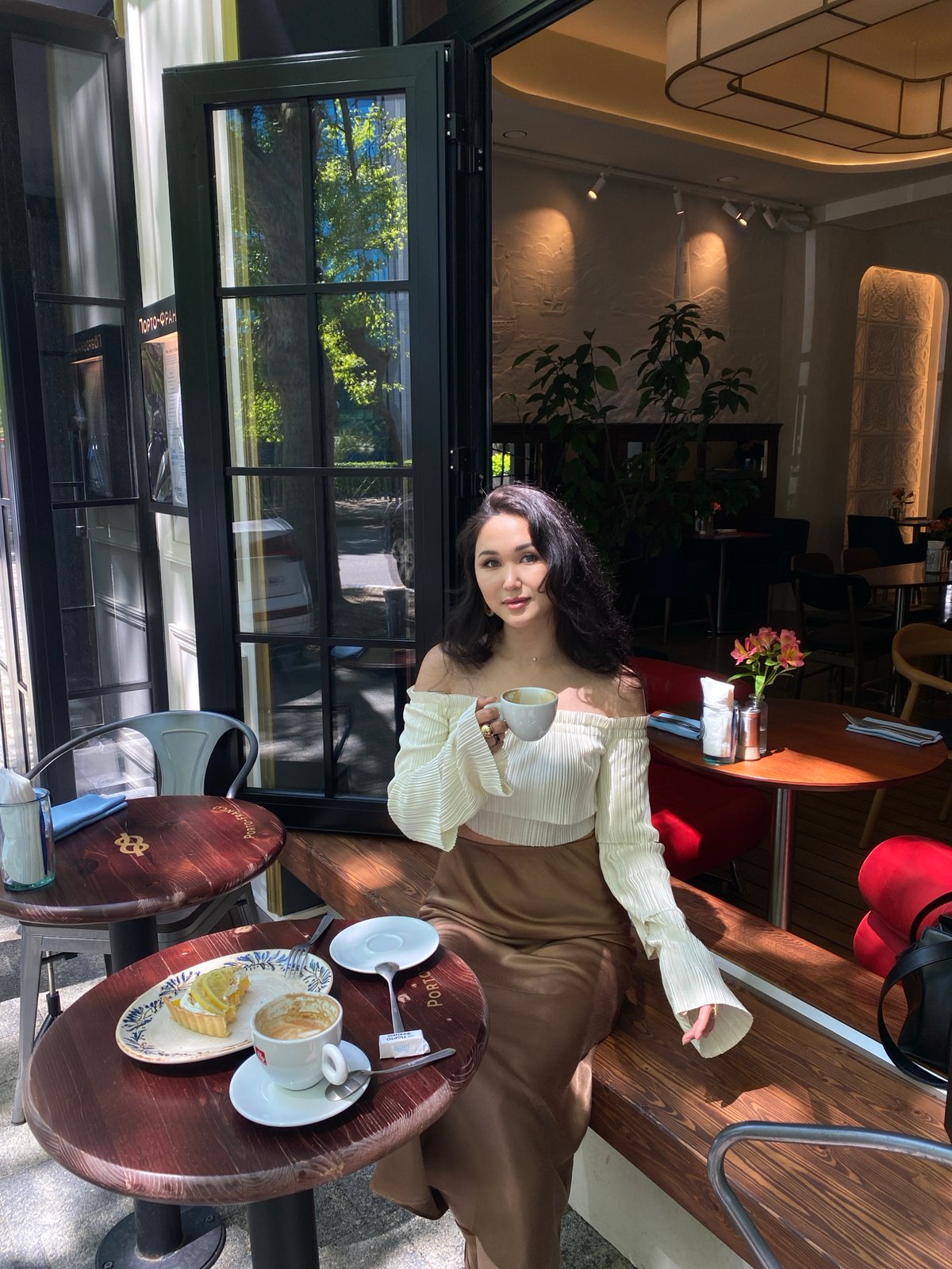 Woman enjoys leisurely morning at Sochi cafes and parks