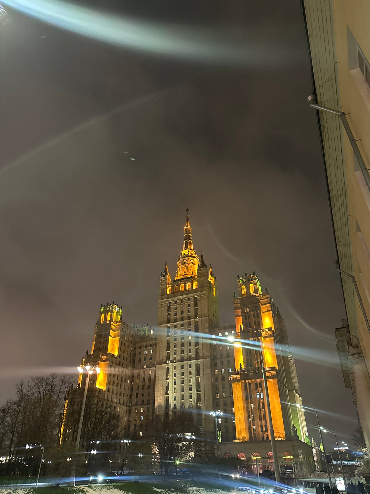 Moscow evening scenes: illuminated buildings and yellow strap interaction