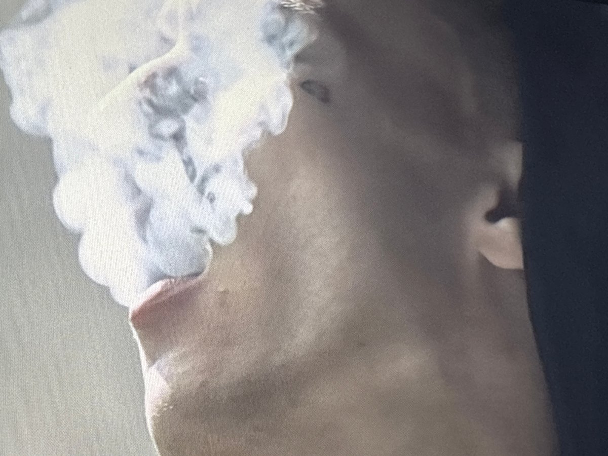 Person vaping in abandoned Buenos Aires building