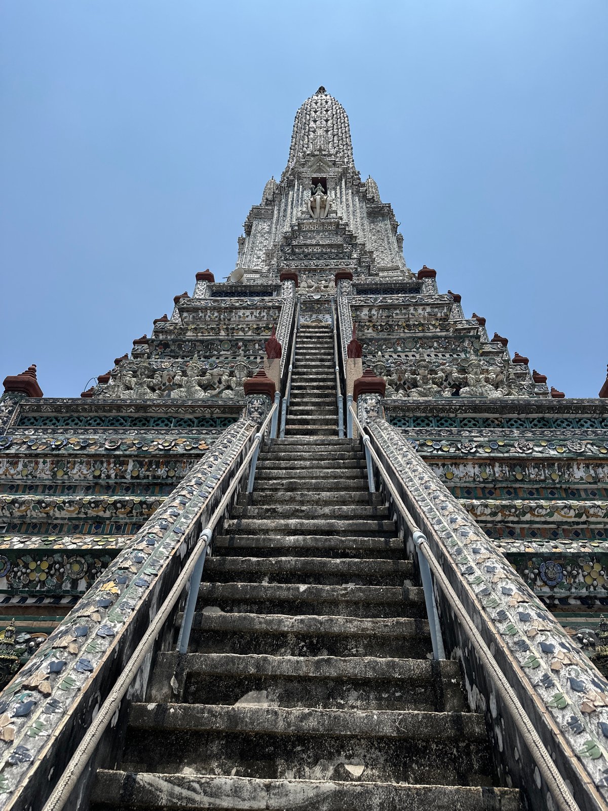 Morning visit captures ornate Bangkok temple interior with golden Buddha