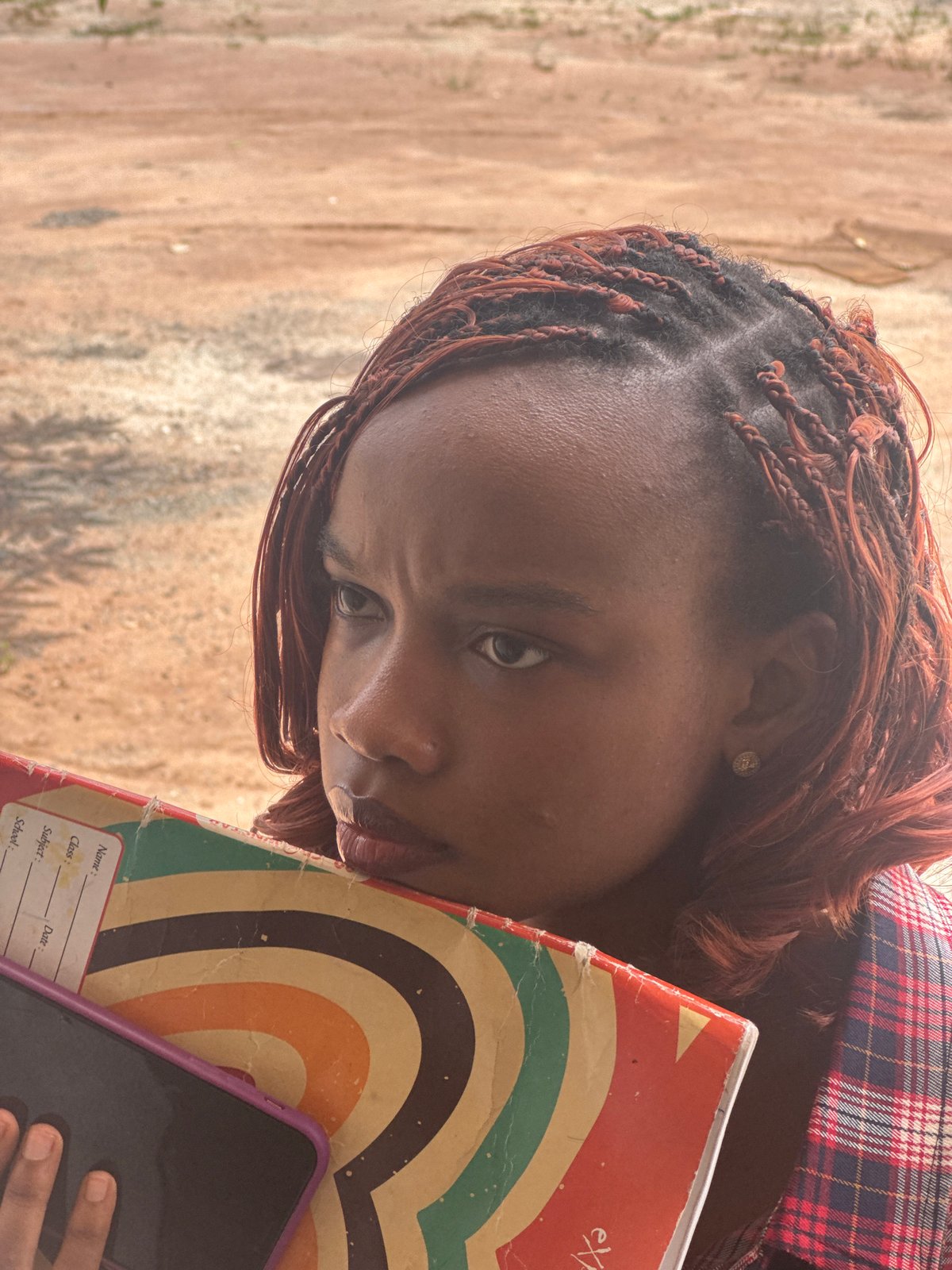 Quiet moments with a globe and earbuds in Ihiagwa, Nigeria