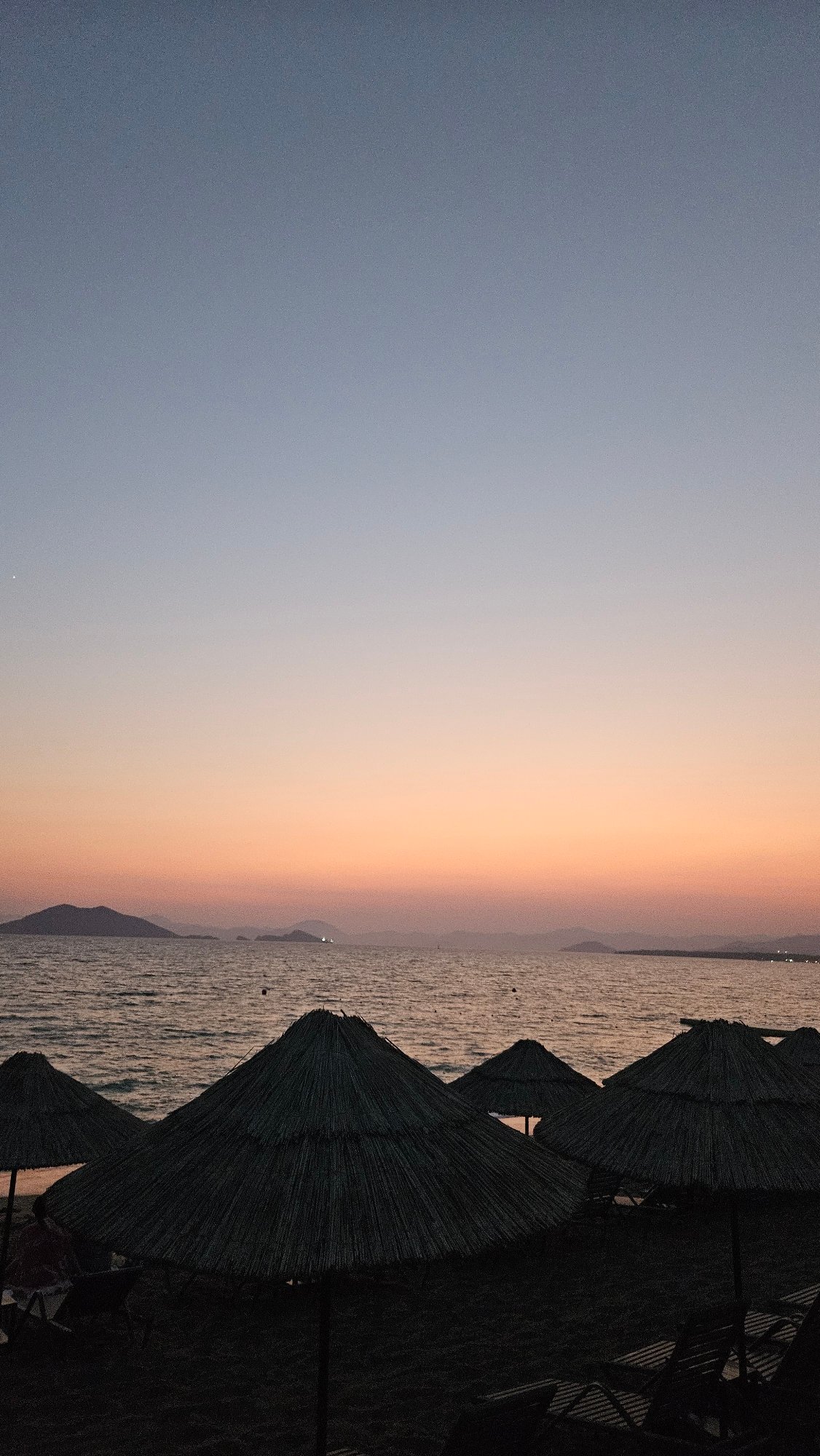 Fethiye beach at sunset, from shoreline to evening promenade
