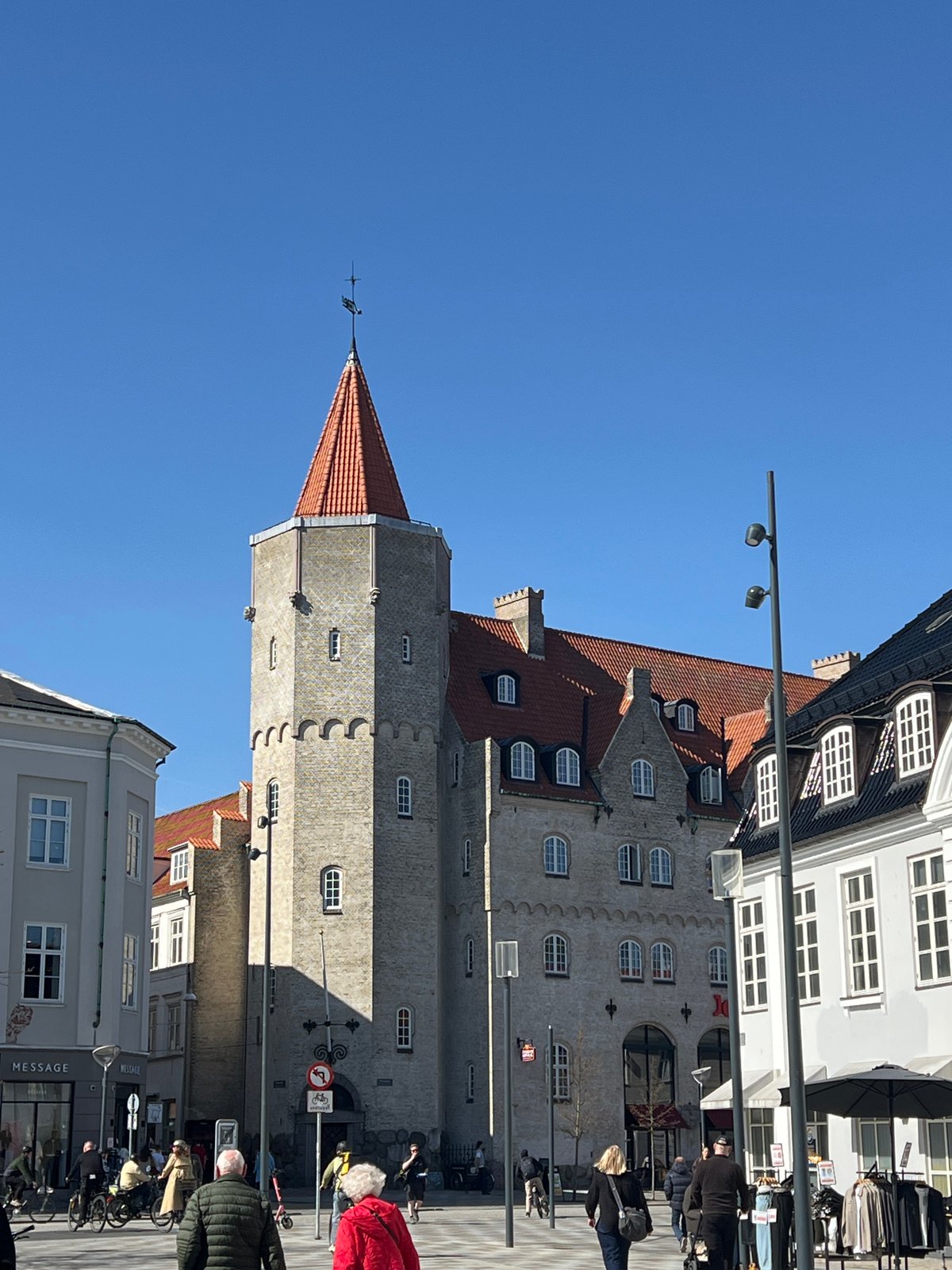 Historical Aalborg architecture documented under clear April skies