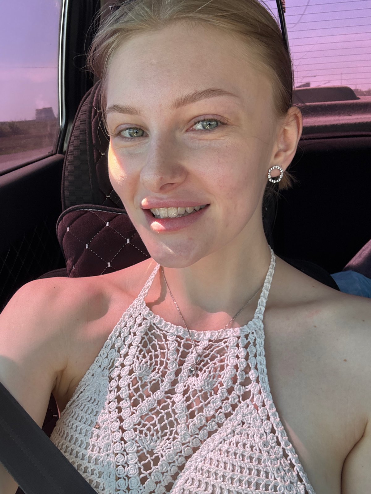 Woman photographed smiling in car in Perm, Russia