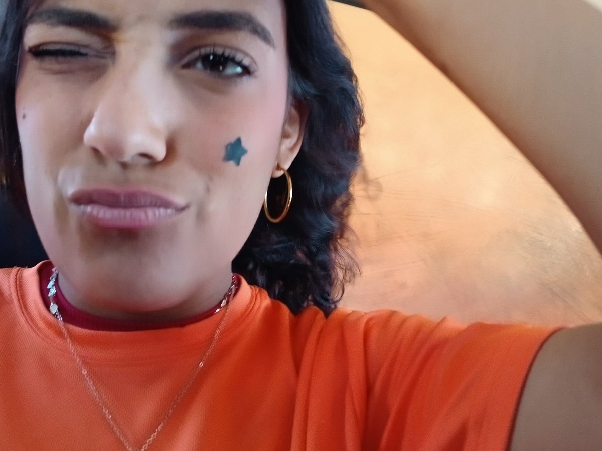 Person takes festive selfie with star face paint in Venezuela