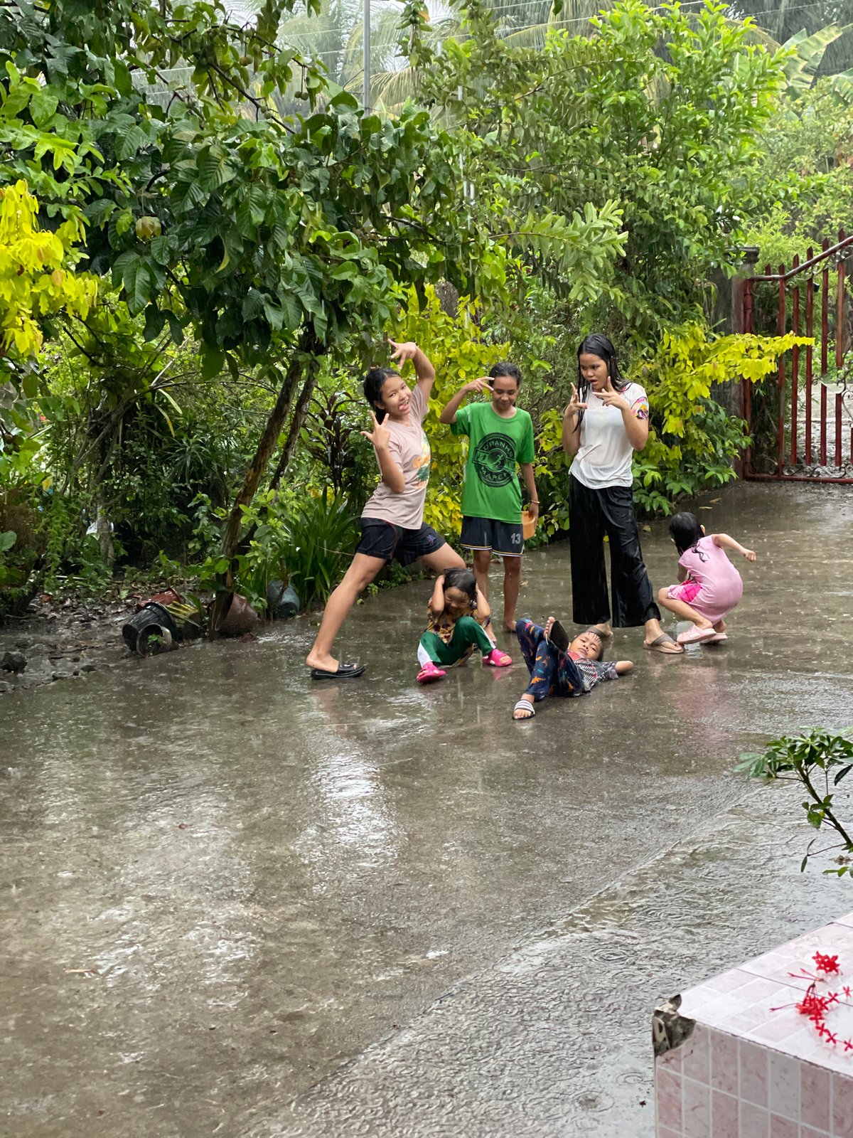 Children play in rain, daily life captured in Kiblawan Philippines