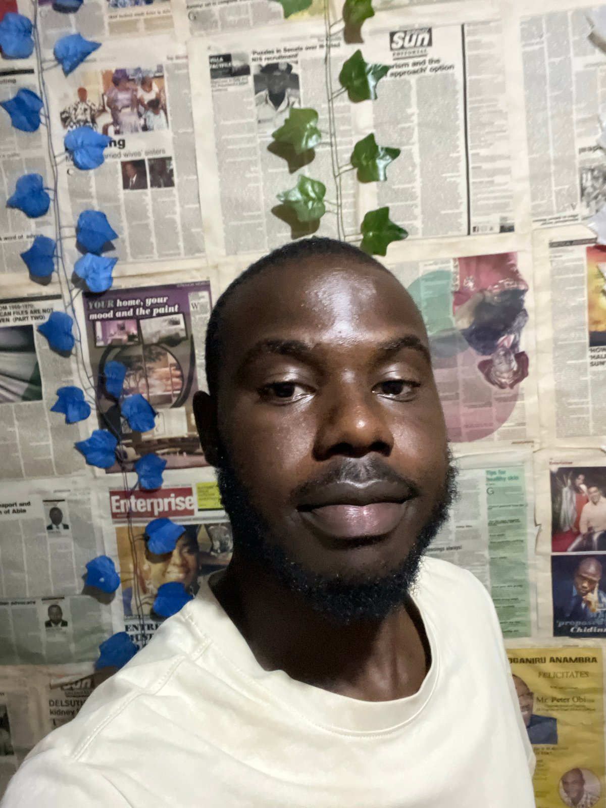 Evening hangout in a Rafin Par home with newspaper-covered walls