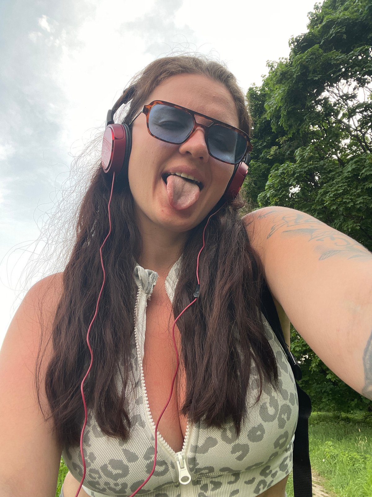 Woman takes selfie with red headphones in Lytkarino