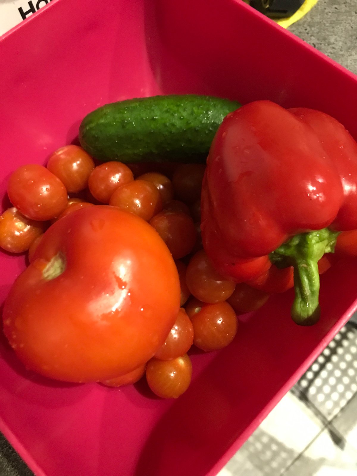 Fresh vegetables displayed in pink container in Sochi