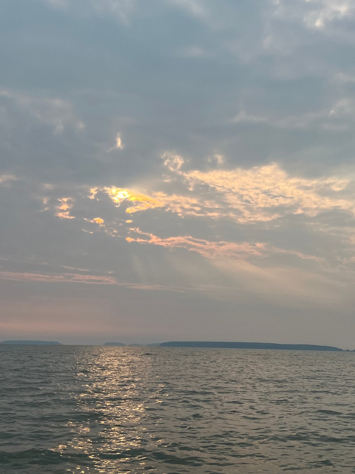 Out on the water near Novopichugovo under a breaking overcast sky