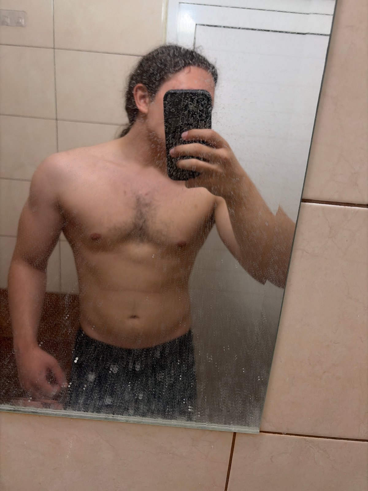 Person takes multiple mirror selfies in Plovdiv bathroom