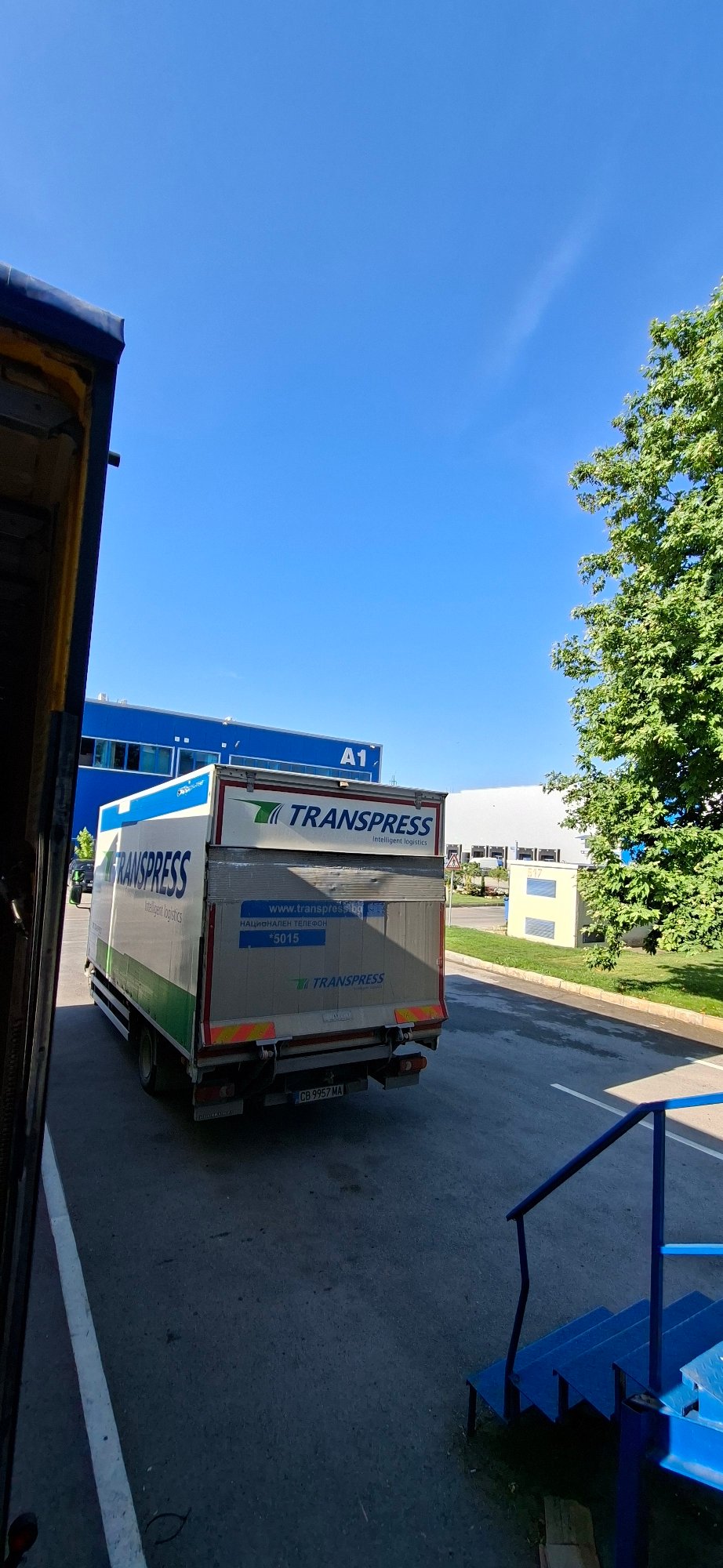 Trucks and warehouse at a Varna industrial site