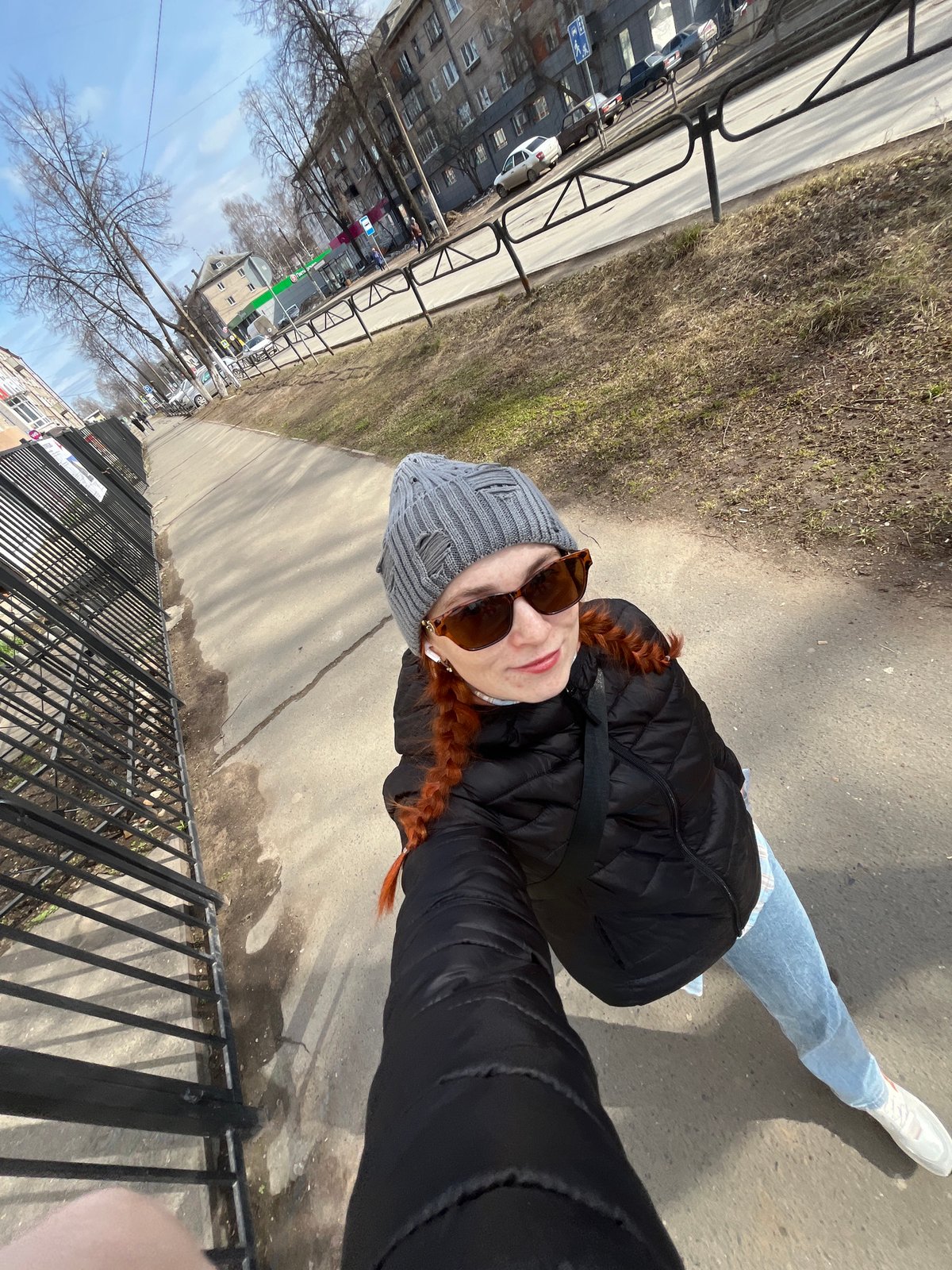 Woman travels through Chaikovsky, Russia by car early morning