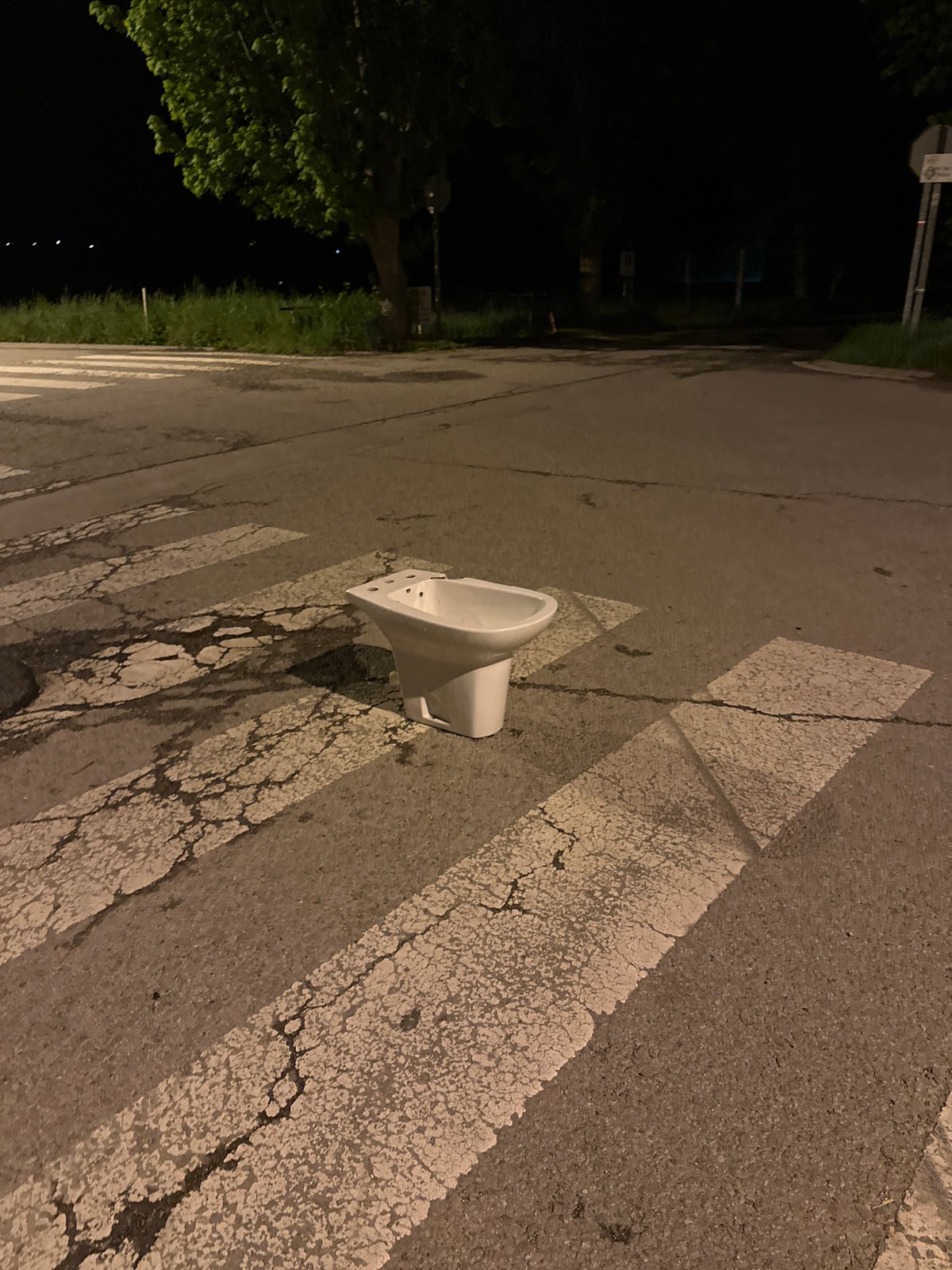 Ceramic urinal found abandoned on crosswalk