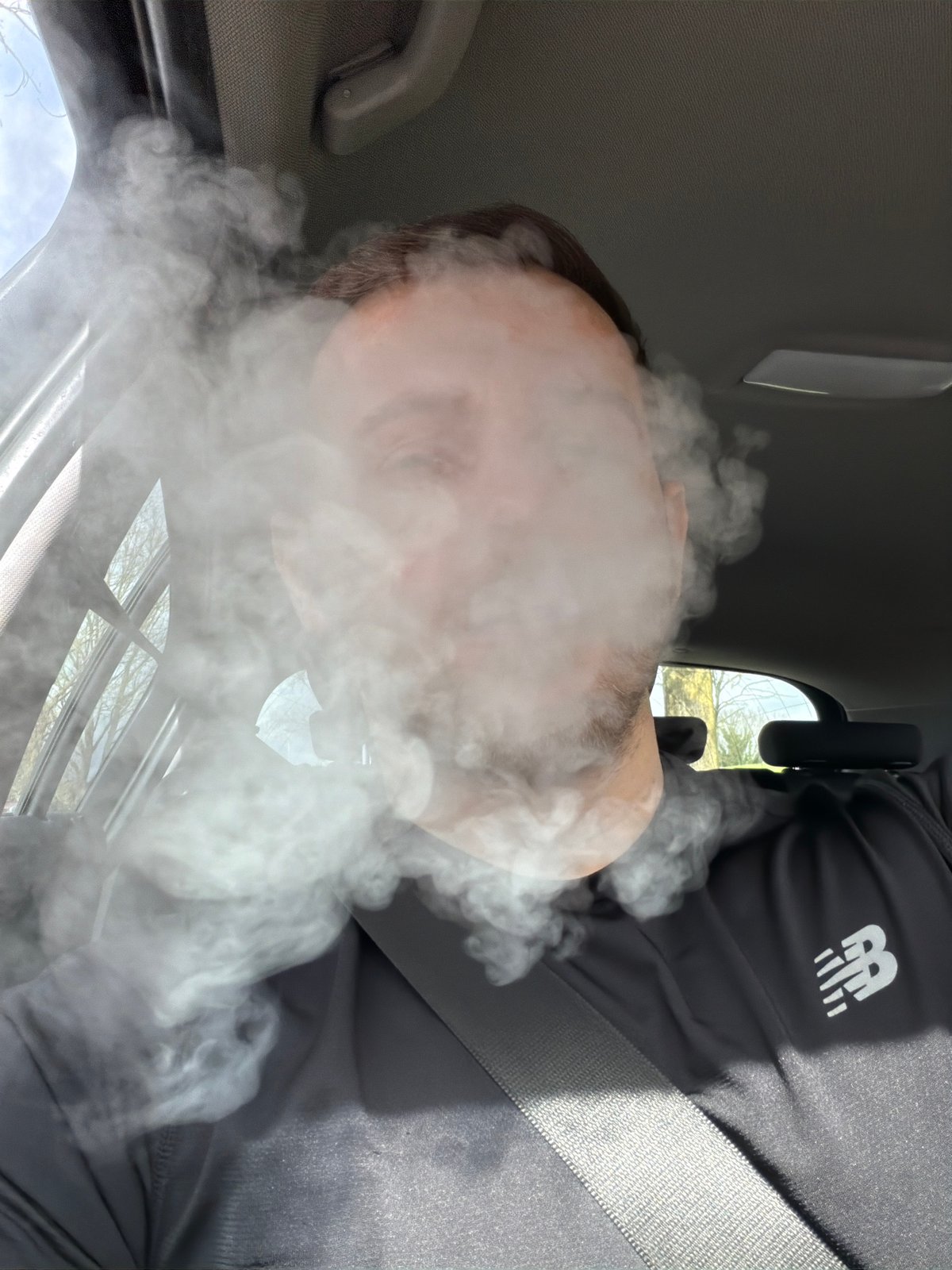Person vaping in vehicle captured in London