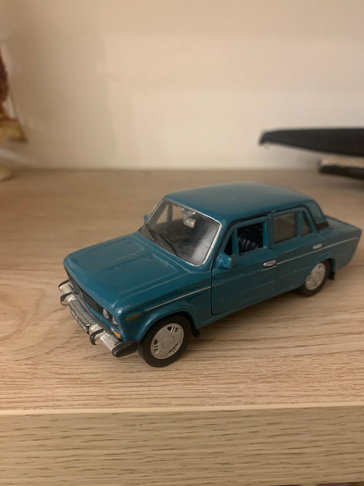 Toy cars and decorative collectibles on display in Kutaisi