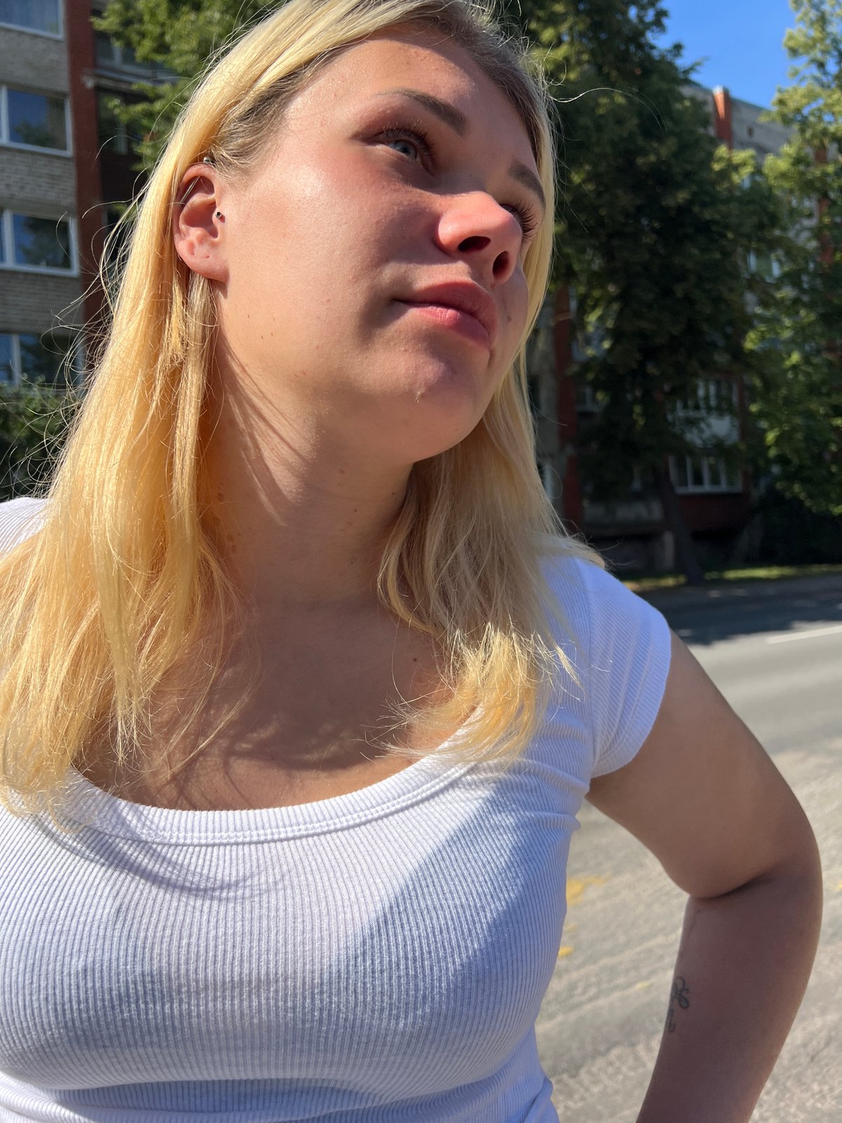 Pause on a sunny Riga sidewalk, summer afternoon