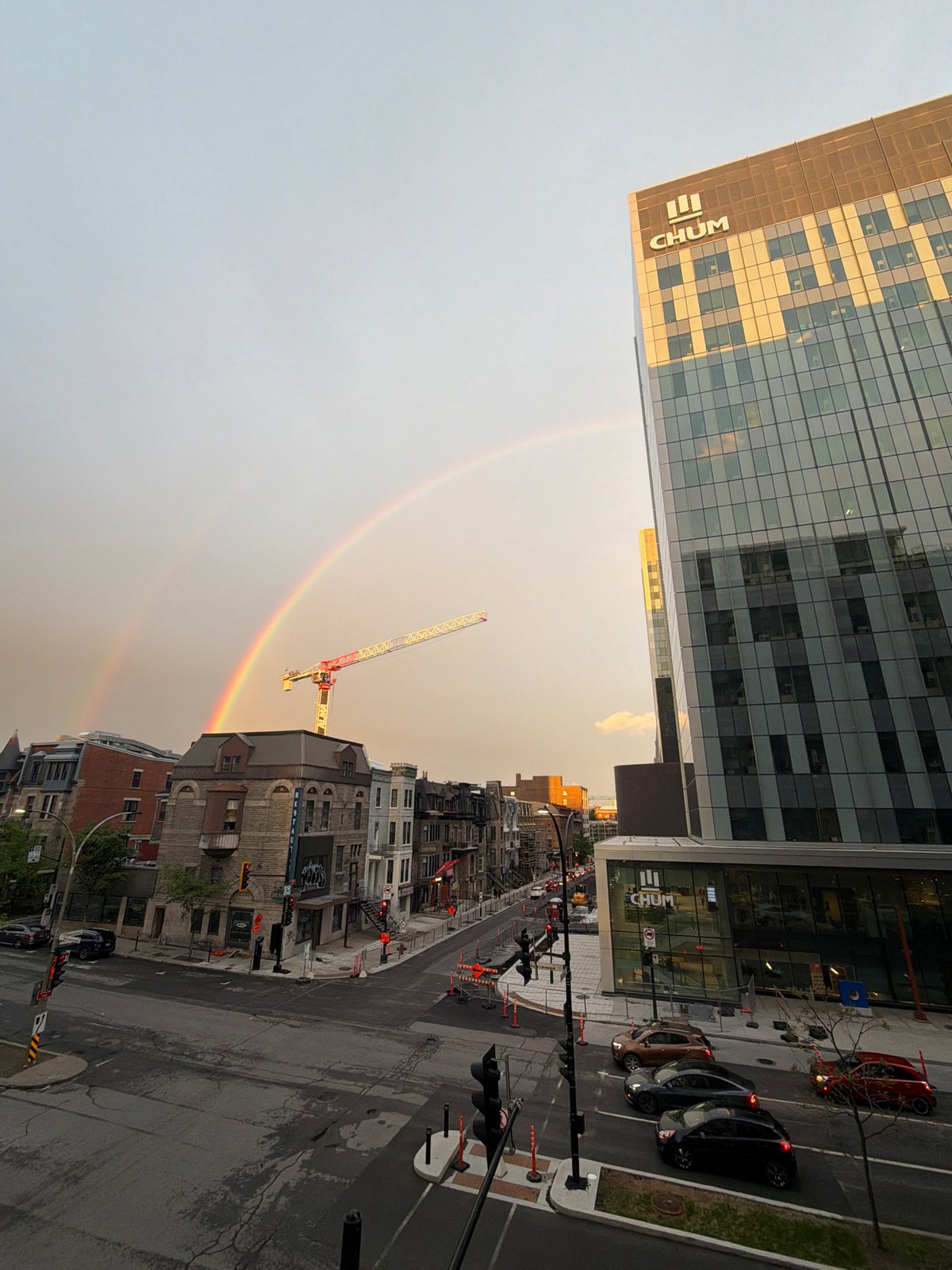 Rainbow appears over downtown Montreal construction site after midnight