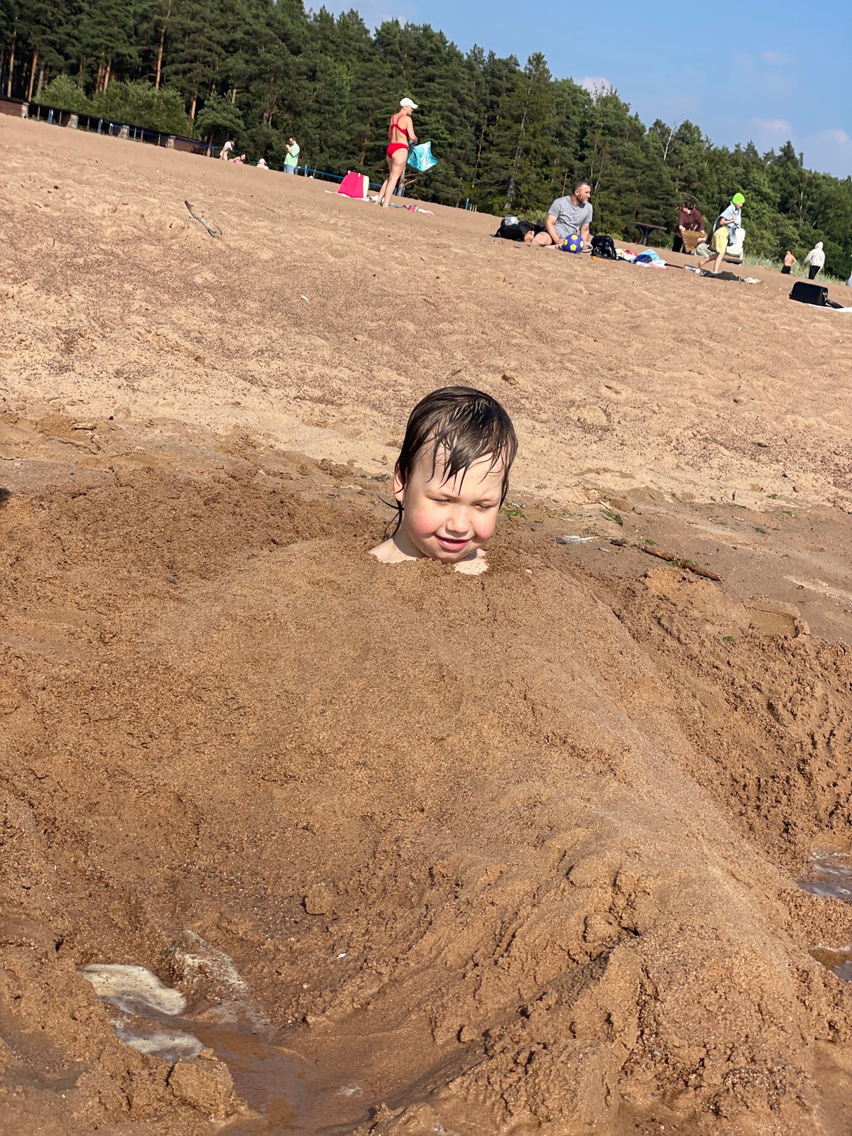 Crowded summer beach day at Solnechnoye, Russia