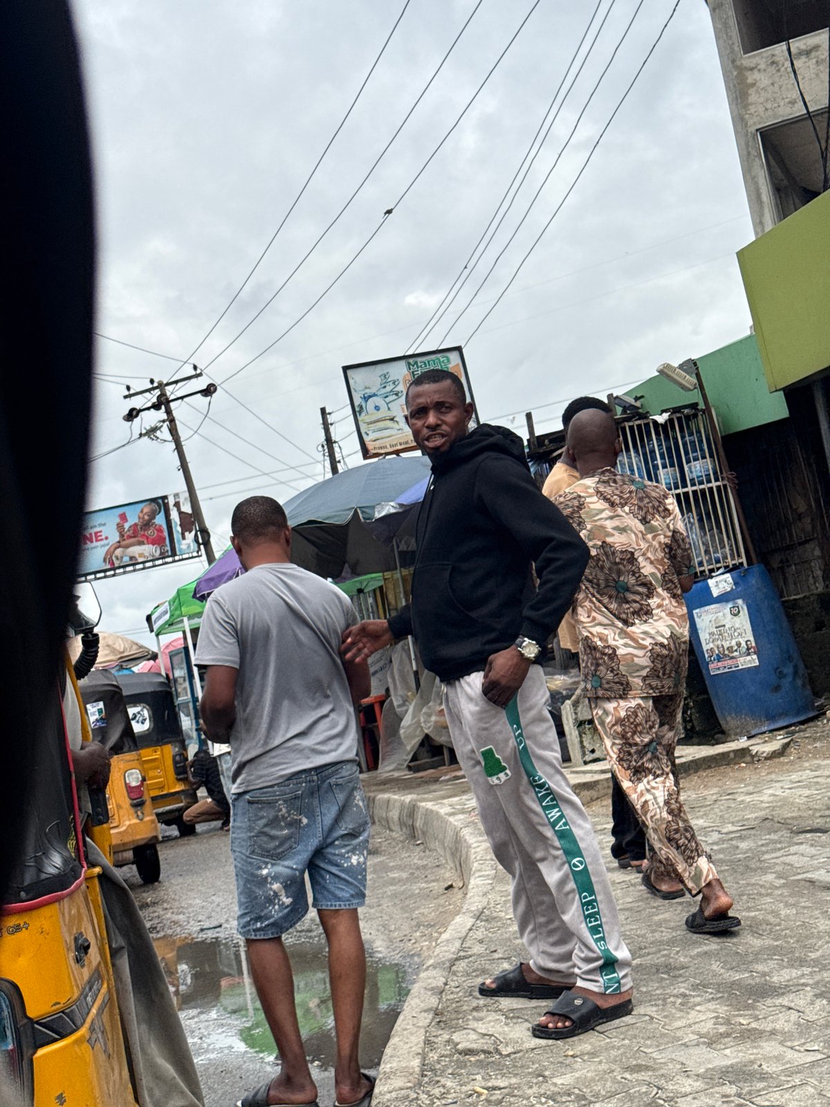 Street market life in Ado, Nigeria: peanuts, rickshaws, and school uniforms