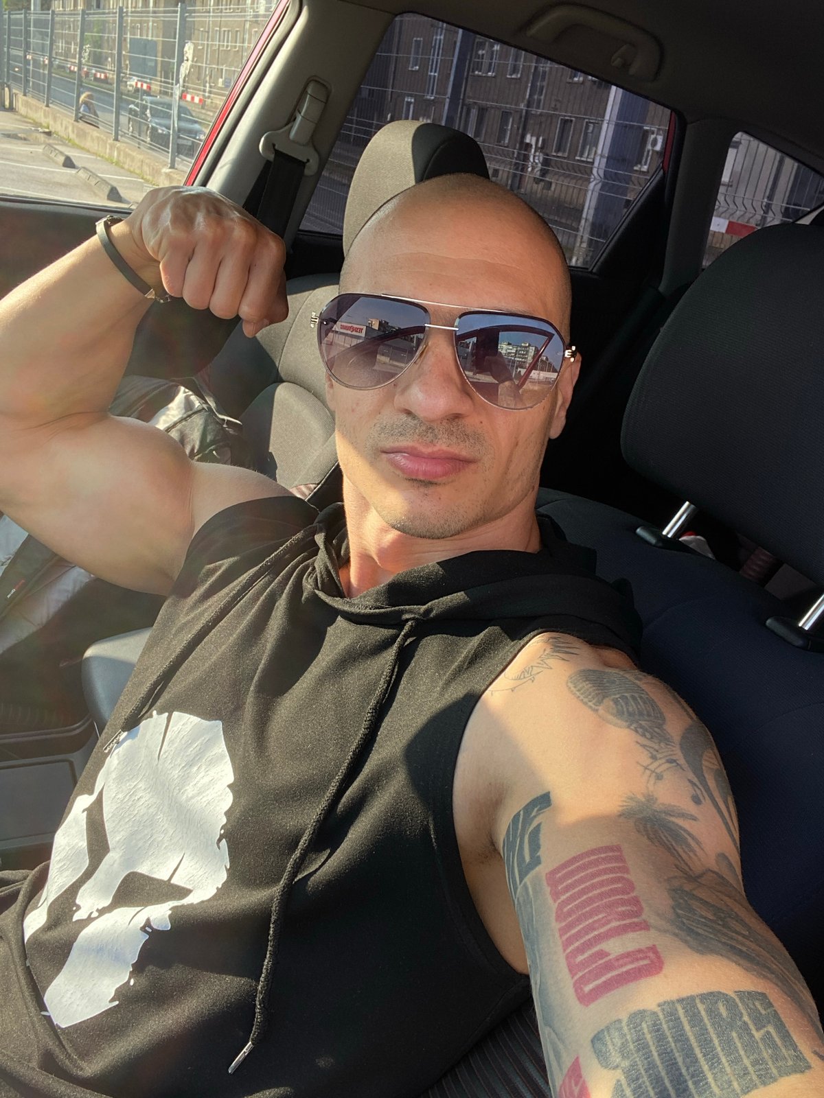 Tattooed man takes multiple selfies in Pleven, Bulgaria morning