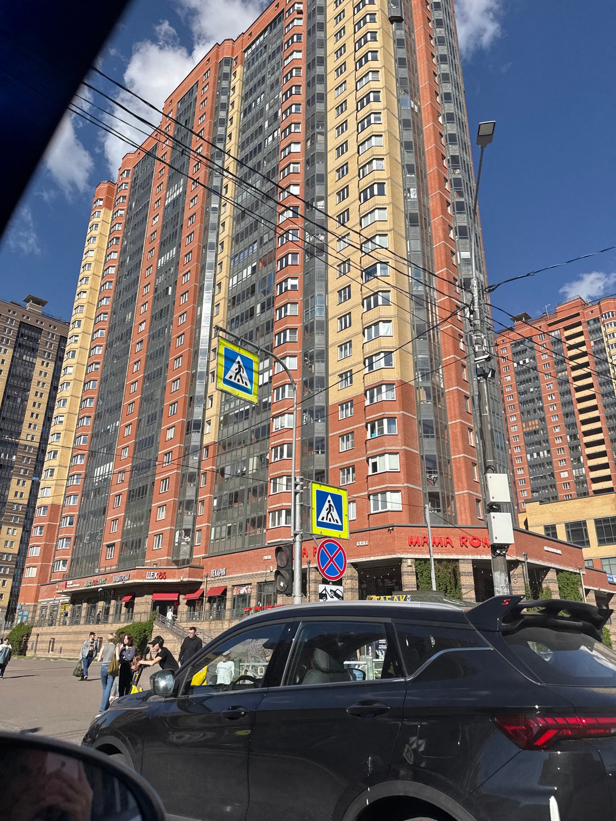 Ordinary street life documented across Saint Petersburg during sunny afternoon