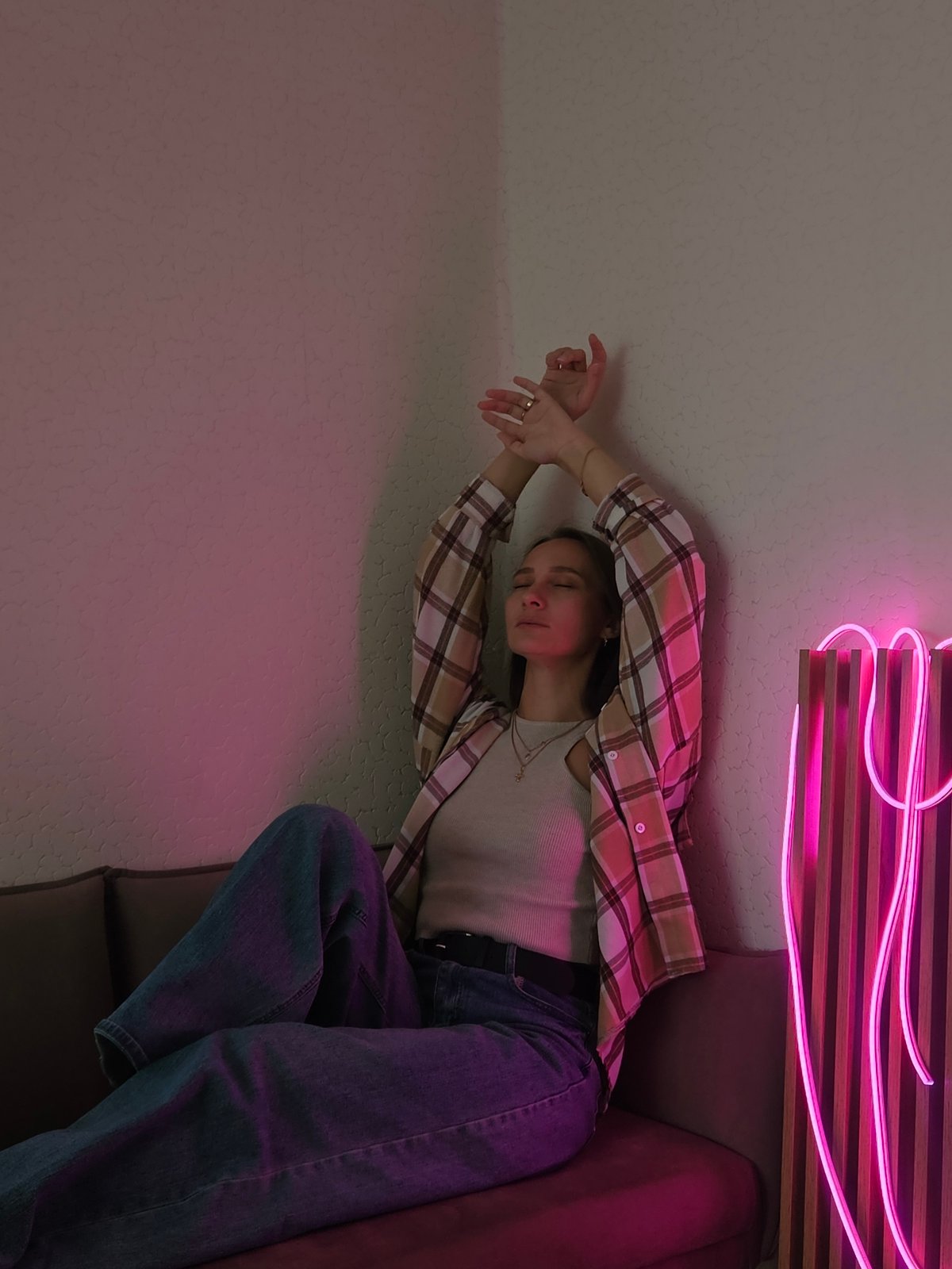 Woman photographed in various indoor poses in Chaikovsky, Russia