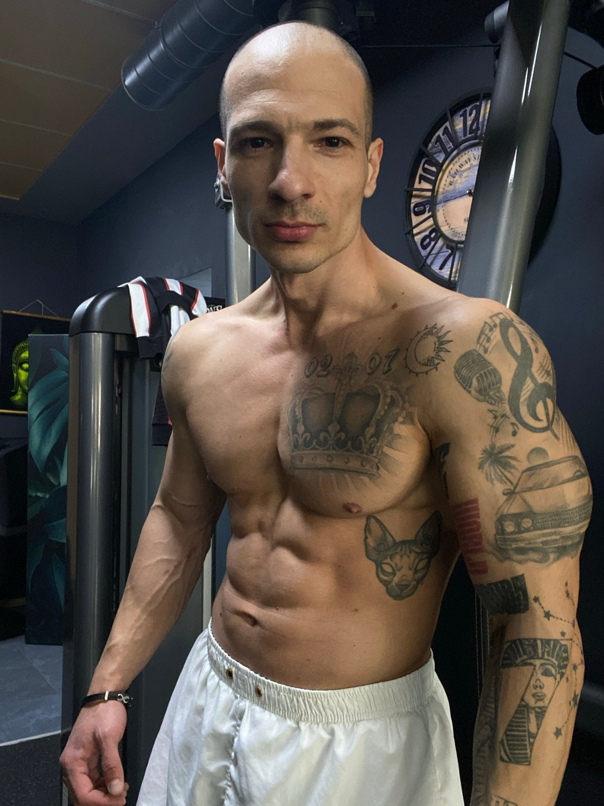 Tattooed man exercises at Pleven gym Friday afternoon