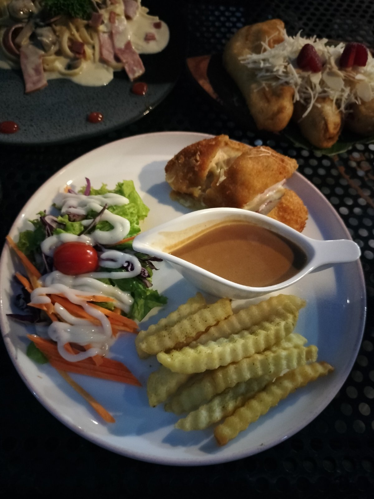 Rooftop dinner spread in Depok with Western and local dishes