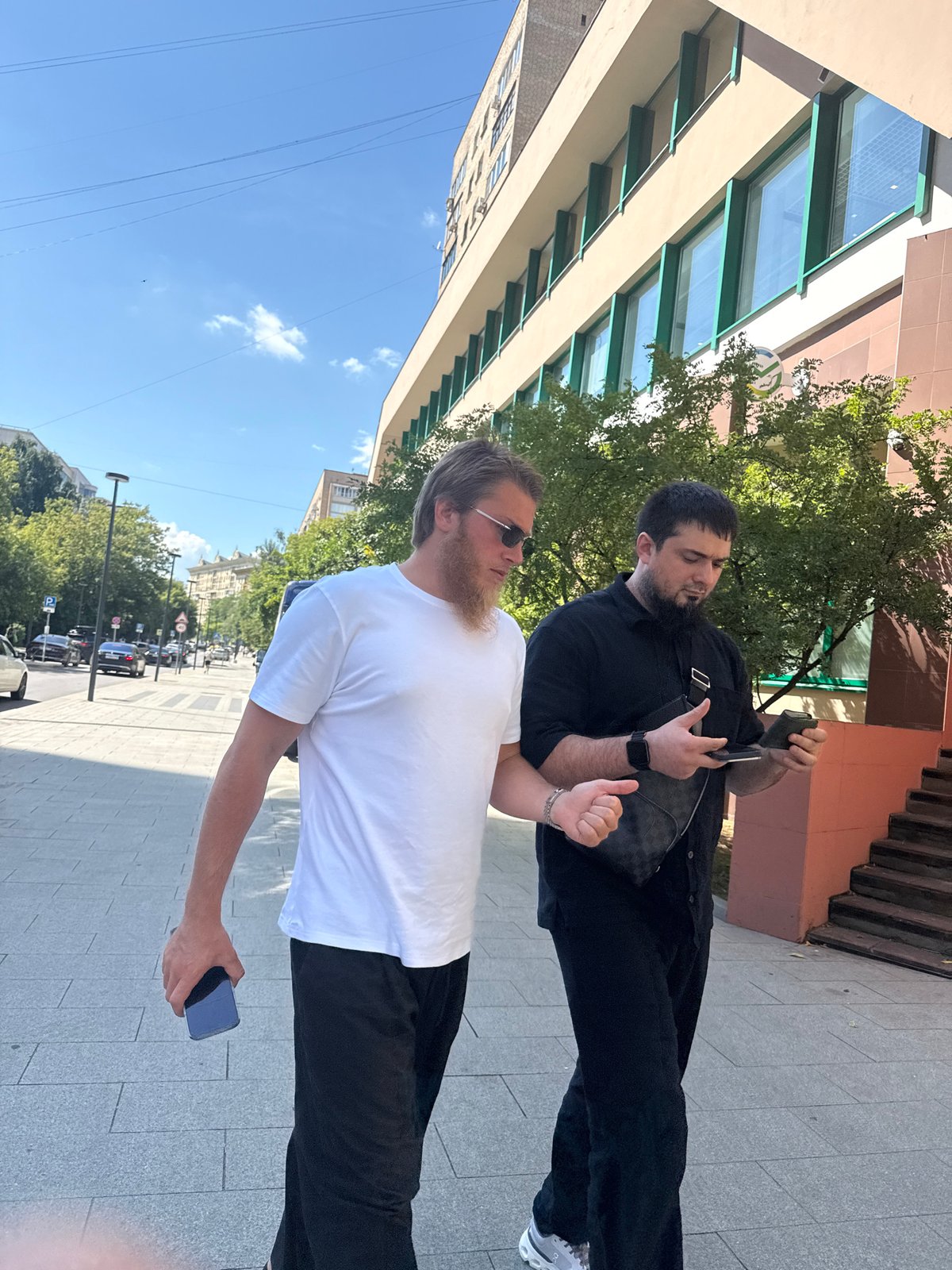 Ordinary foot traffic and street activity on a sunny Moscow afternoon.