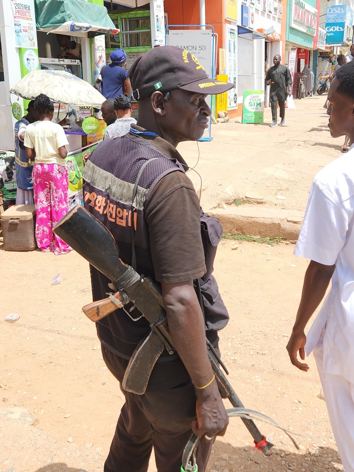 Man observed near electronics shops in urban commercial district