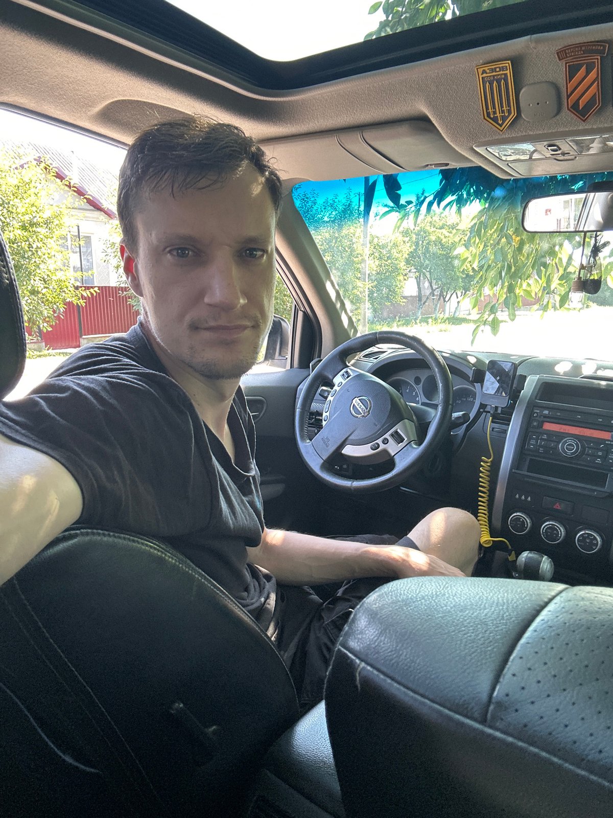 Driver's seat selfies in Shatava, sunroof open, trident decal in view