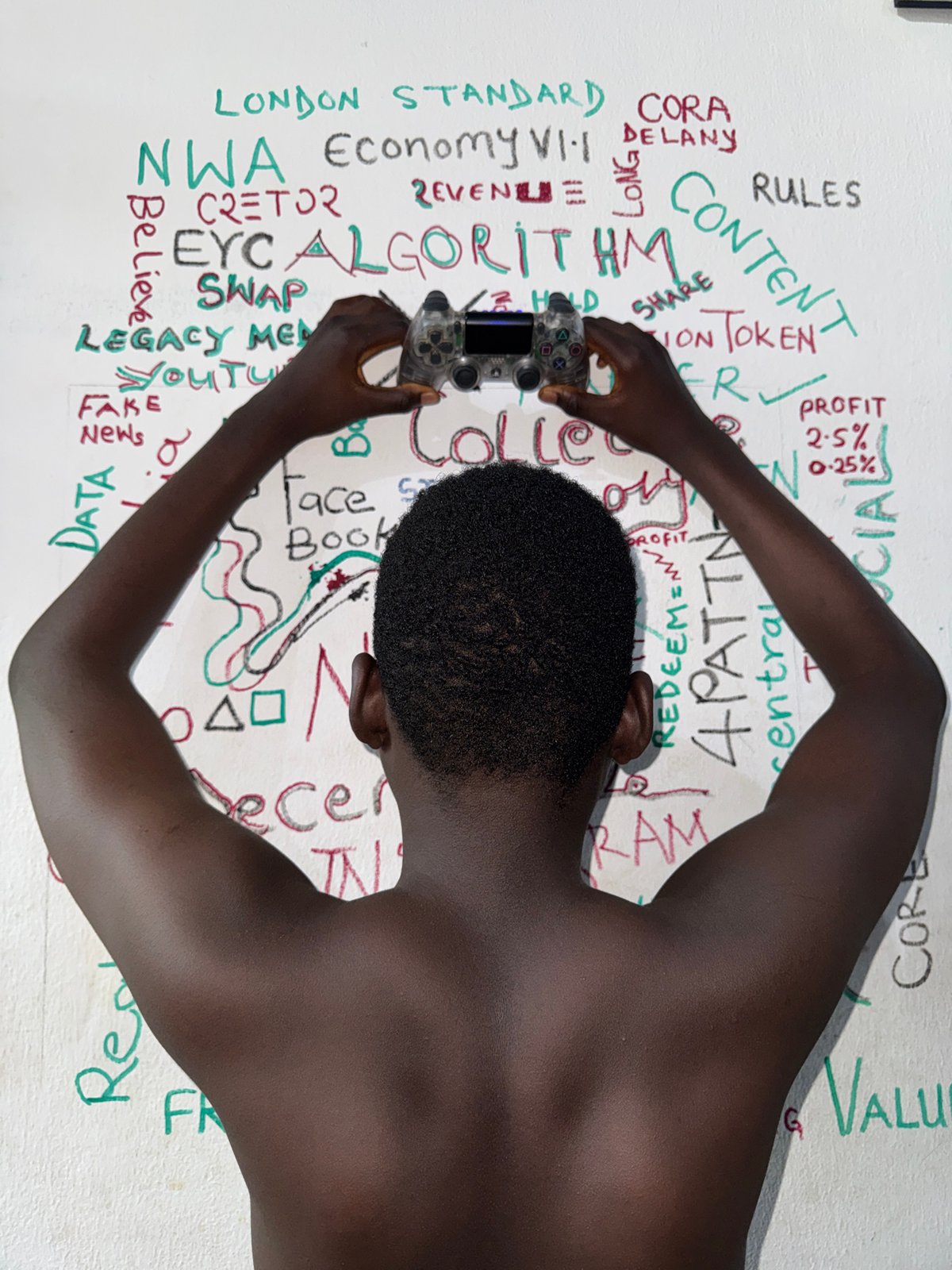 Person photographed drinking water by decorated wall in Ado