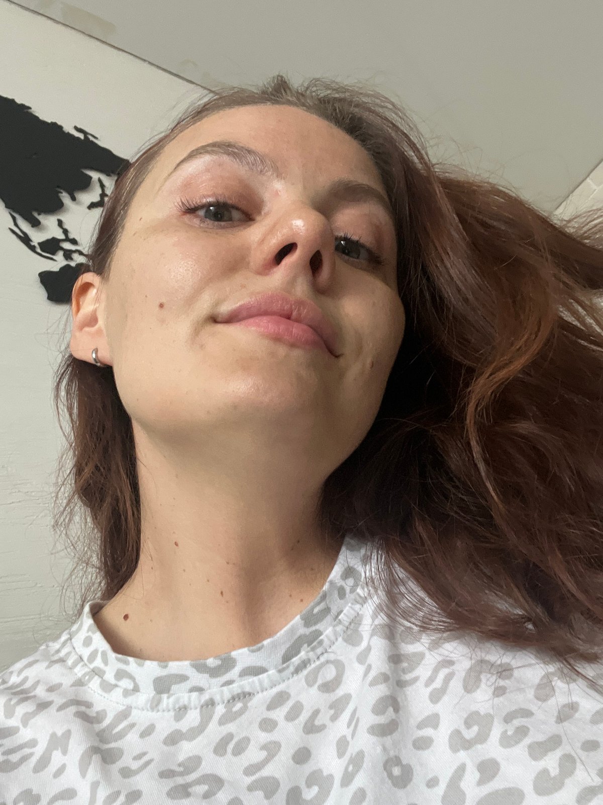 Woman photographed near car and archery targets in Chaikovsky