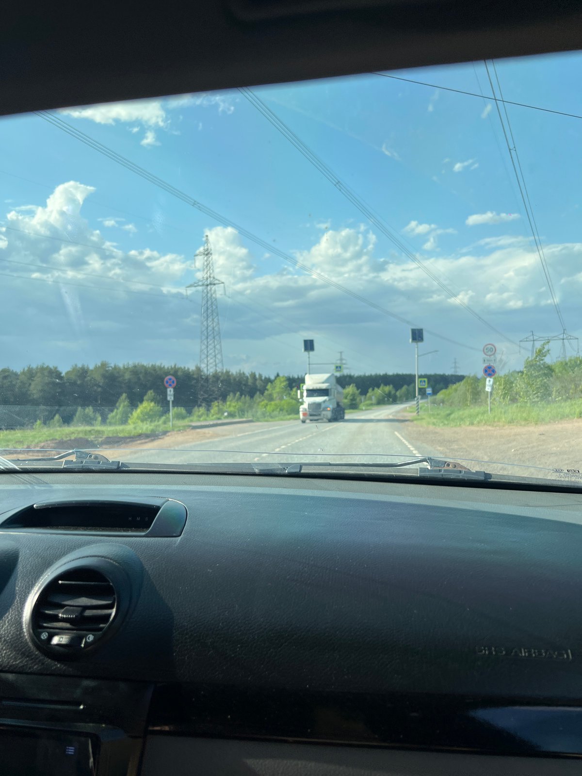 White truck spotted on Chaikovsky road amid cloudy afternoon