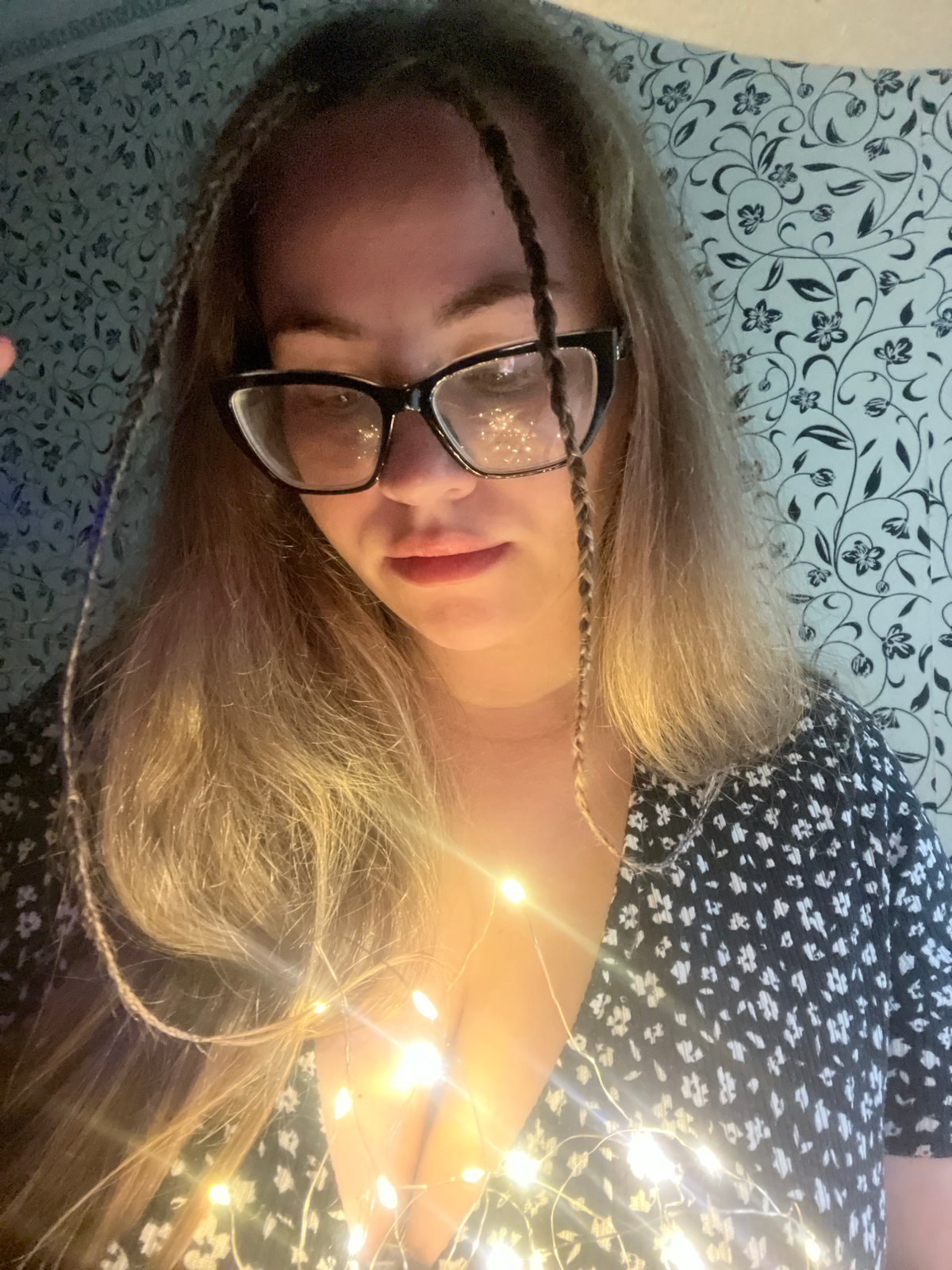 Woman poses with fairy lights in casual photo session
