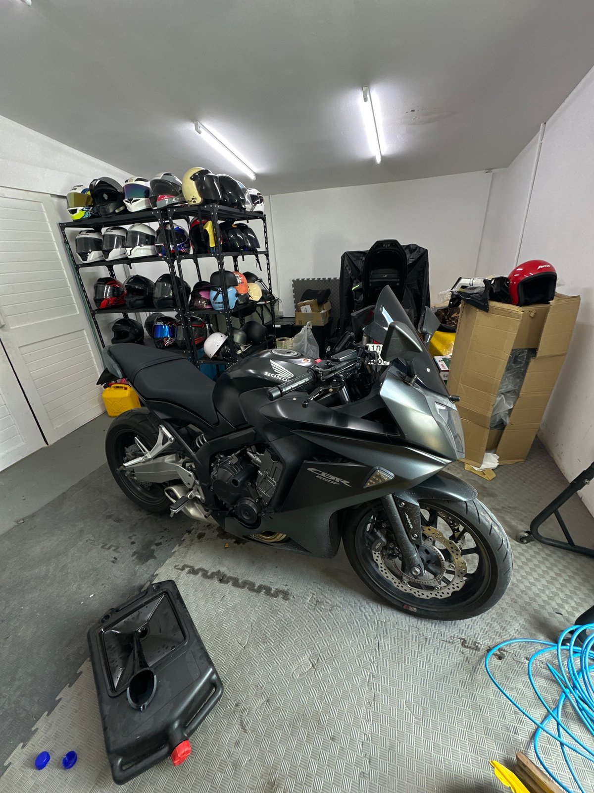Motorcycles and gear at a Karon storage spot, early morning