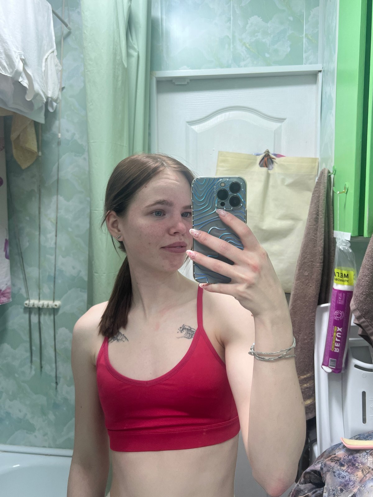 Woman photographed in various indoor settings in Chaikovsky, Russia