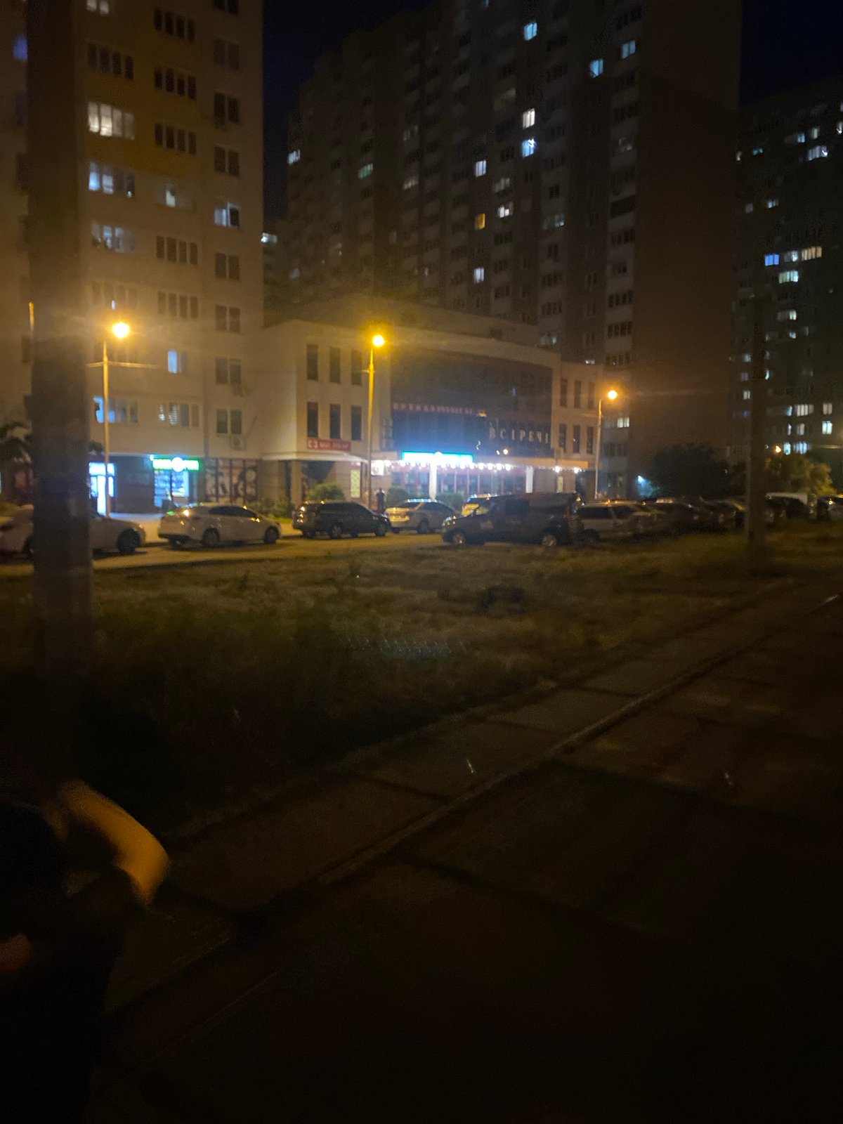 Nighttime street scene near a Kyiv residential block