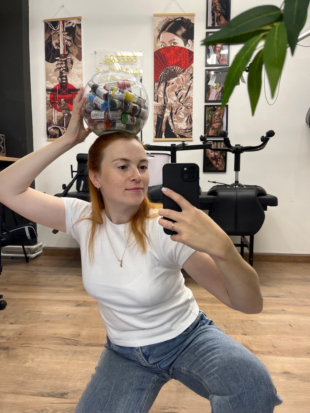 Mirror selfies in a Chaikovsky tattoo studio, ink bowl balanced on head