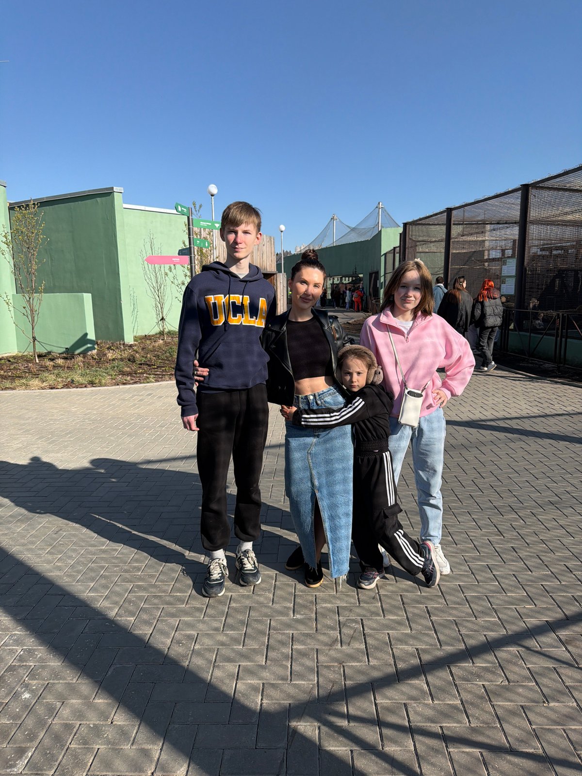 Family visits zoo enclosure in Perm, Russia