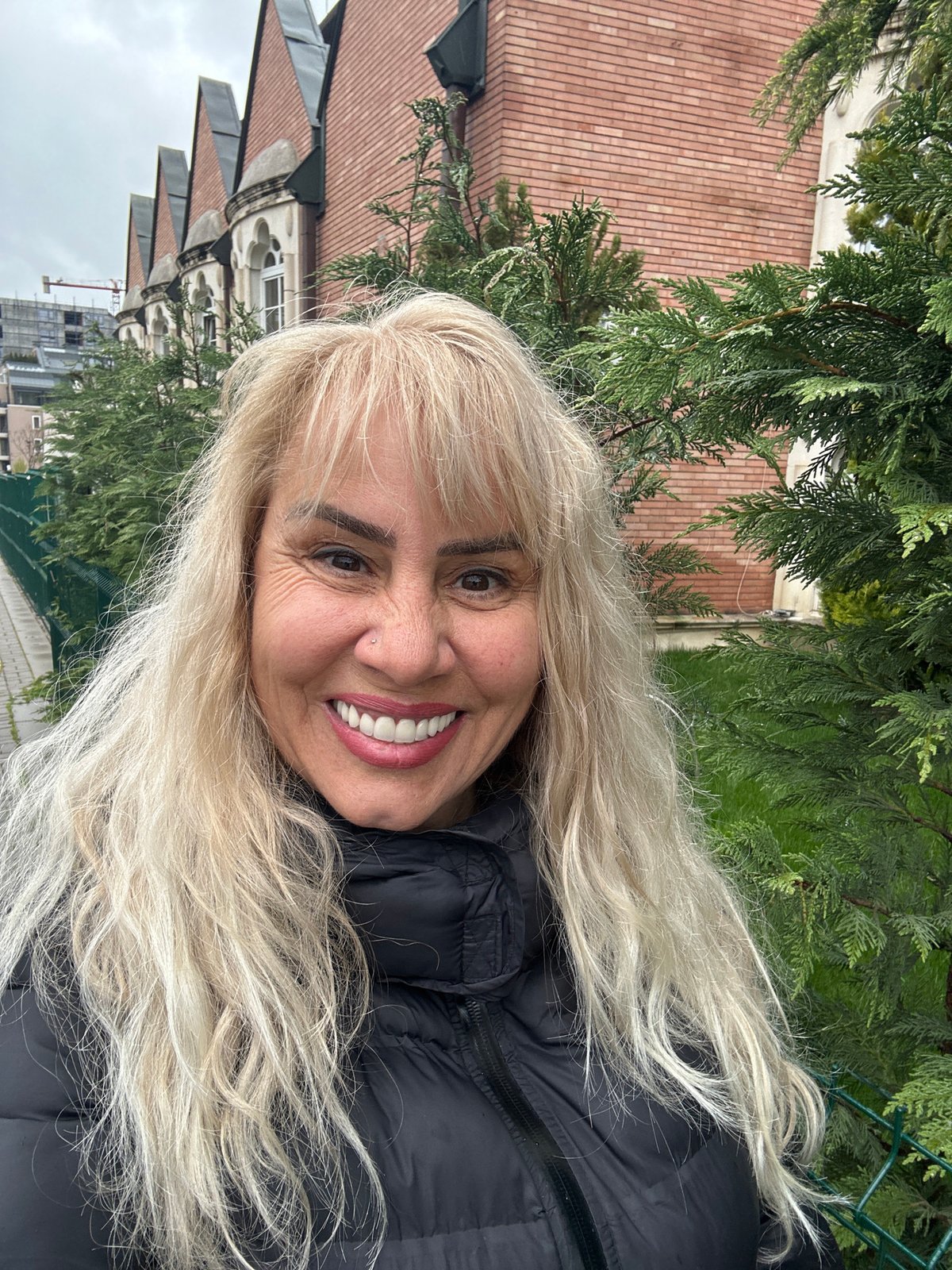 Woman photographed smiling in Sofia with urban backdrop