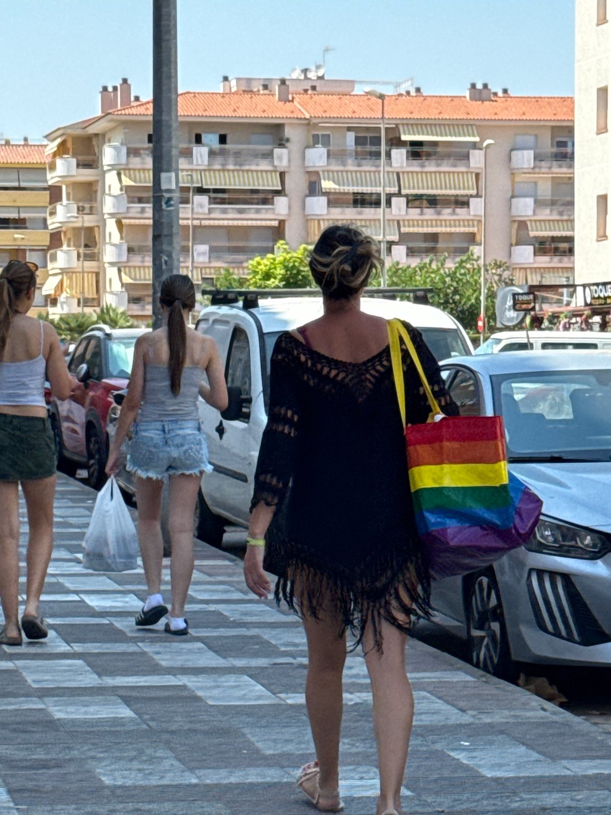 Blanes market scene with local police and souvenir stalls