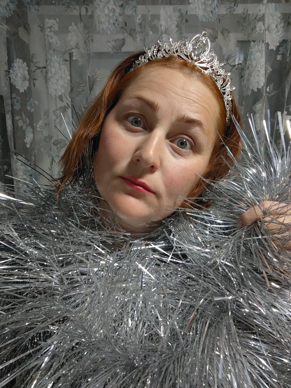 Woman in tiara, silver dress photographed in Markovskii, Russia