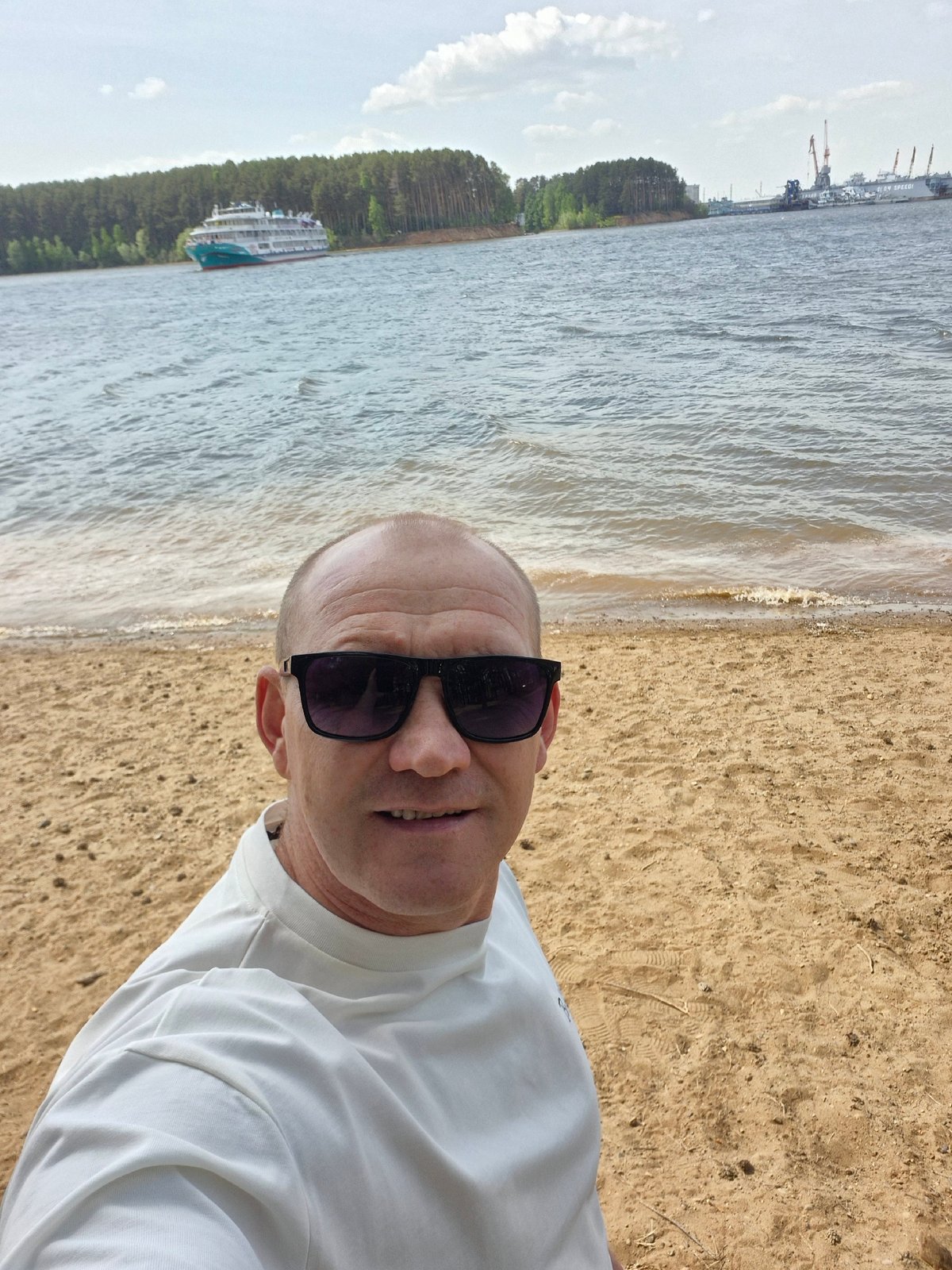 Man takes selfie on beach near Chaikovsky, Russia