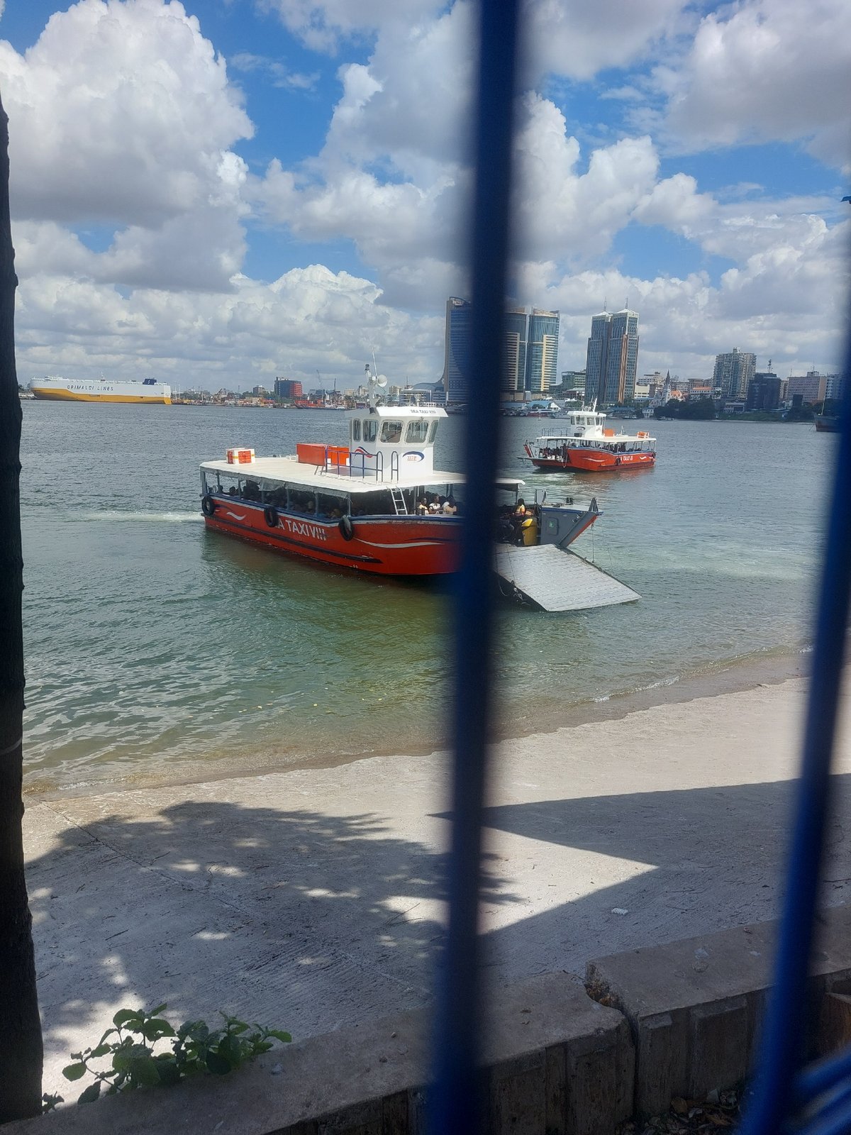 Morning life documented across Dar es Salaam's streets and harbor